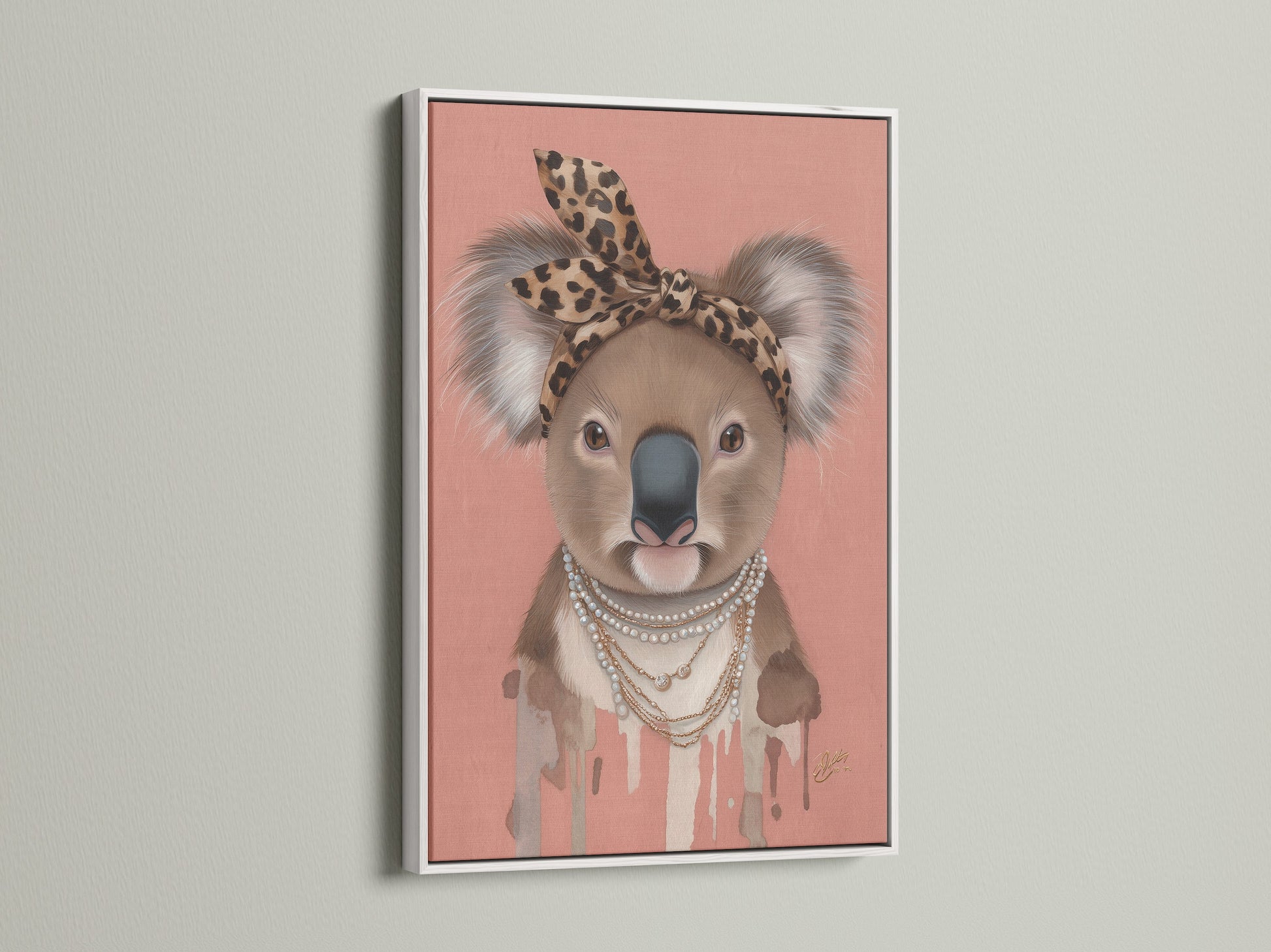 White Frame showcases the Koala Wall Art a trendy nursery piece. The art features a Koala with a leopard print headband and pearl necklace. This quirky animal print adds style to any kids' room wall.