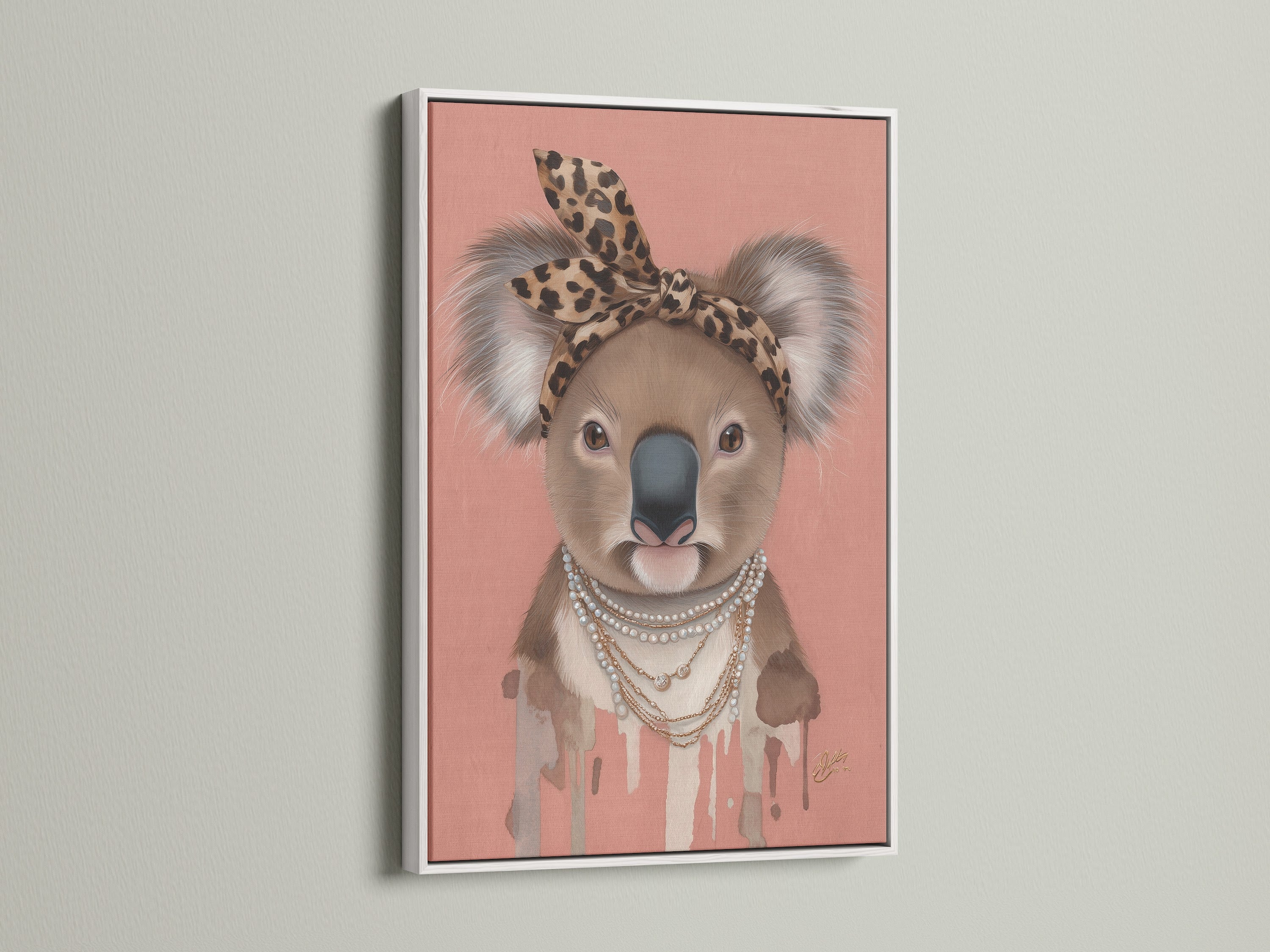White Frame showcases the Koala Wall Art a trendy nursery piece. The art features a Koala with a leopard print headband and pearl necklace. This quirky animal print adds style to any kids' room wall.