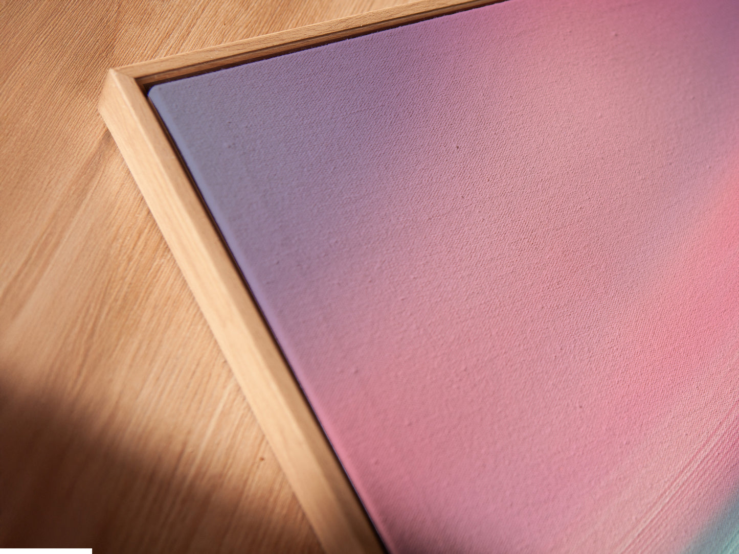 Close-up of a canvas print in a floating frame. The floating frame gives the art a modern look. The canvas appears to float within the frame. This style adds depth and dimension to the piece. The frame enhances the artwork's presentation. Experience art in a floating frame.