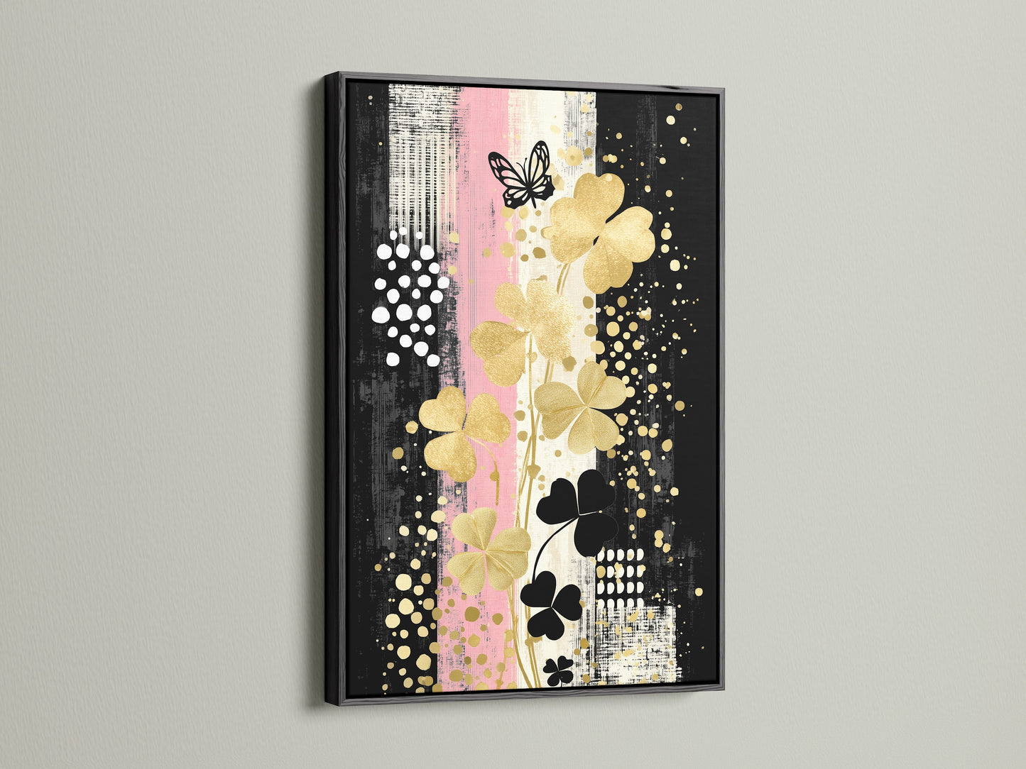 Clover Canvas Print art presented in a black frame. The bold frame complements the gold and black floral artwork. Elevate your space with this contemporary wall decor.