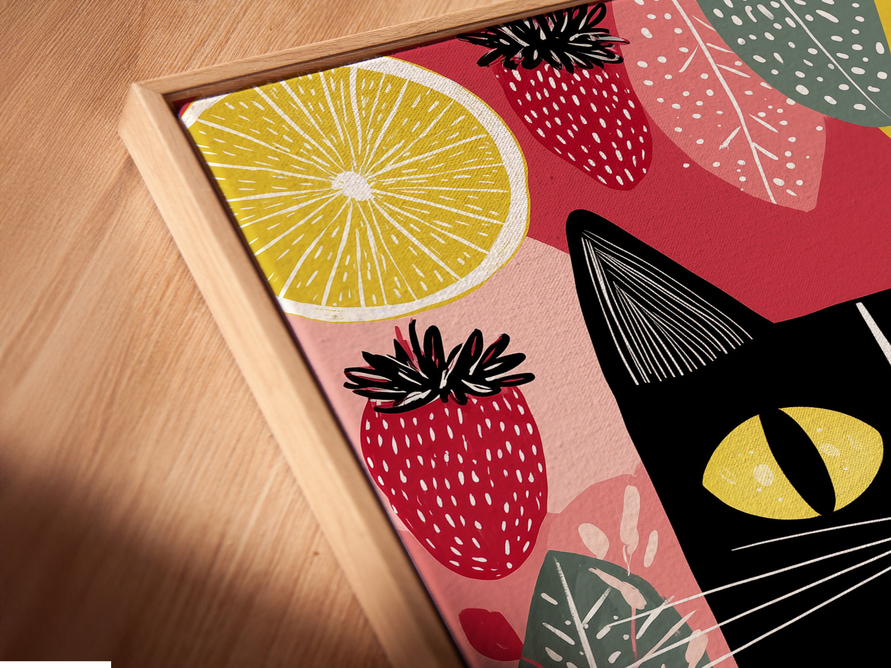 A close up shows a canvas print in a floating frame. The artwork is a modern folk cat with fruit. The floating frame adds a contemporary touch. The cat wall art is perfect for kitchen decor. It is ideal for adding personality to any space. Its primary color is yellow.