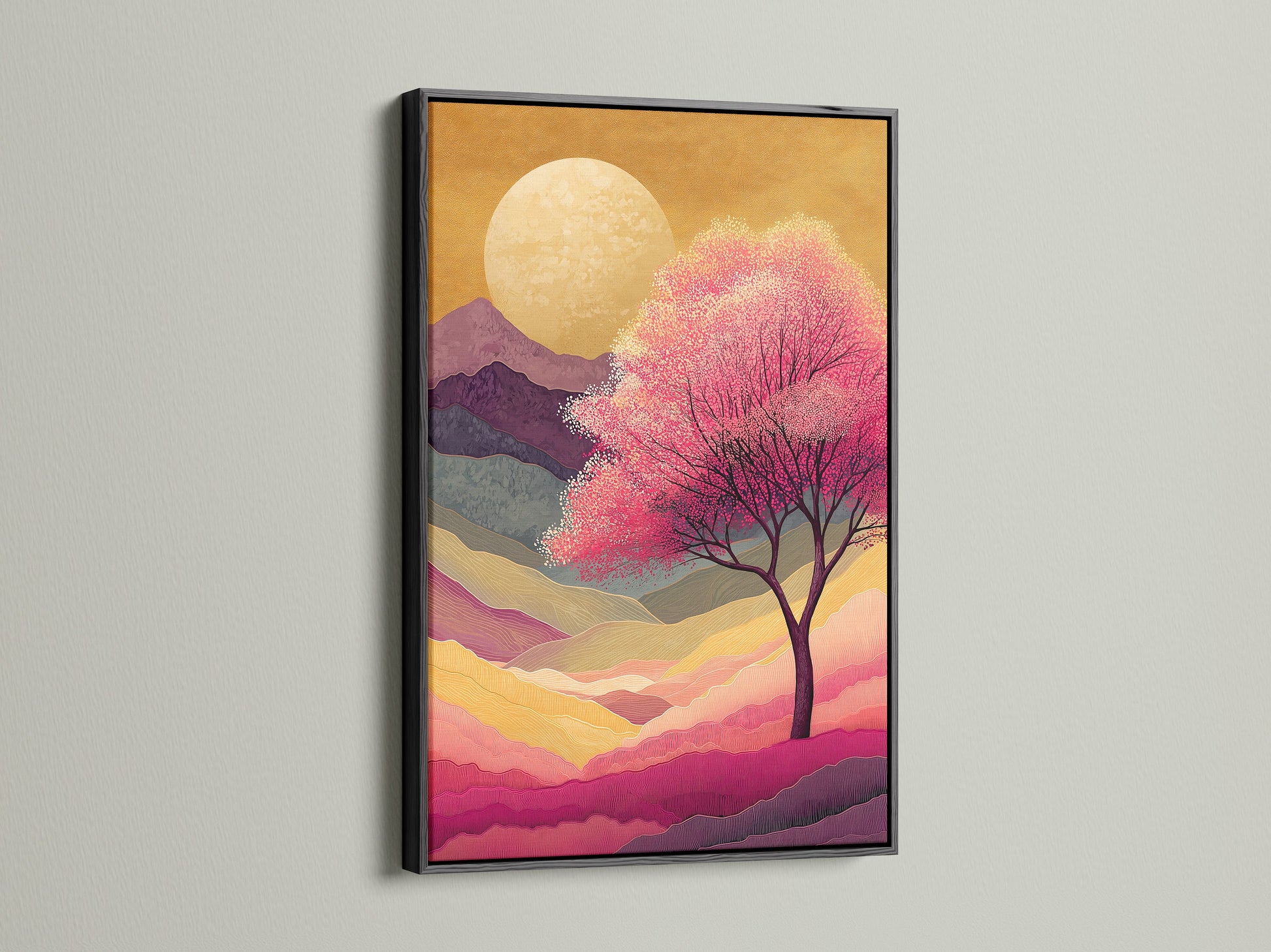 Japanese Cherry Blossom artwork is displayed in a black frame. The artwork features a pink sunset mountain landscape. It provides zen wall decor for any bedroom. The art is a striking contrast. A modern touch to any room.