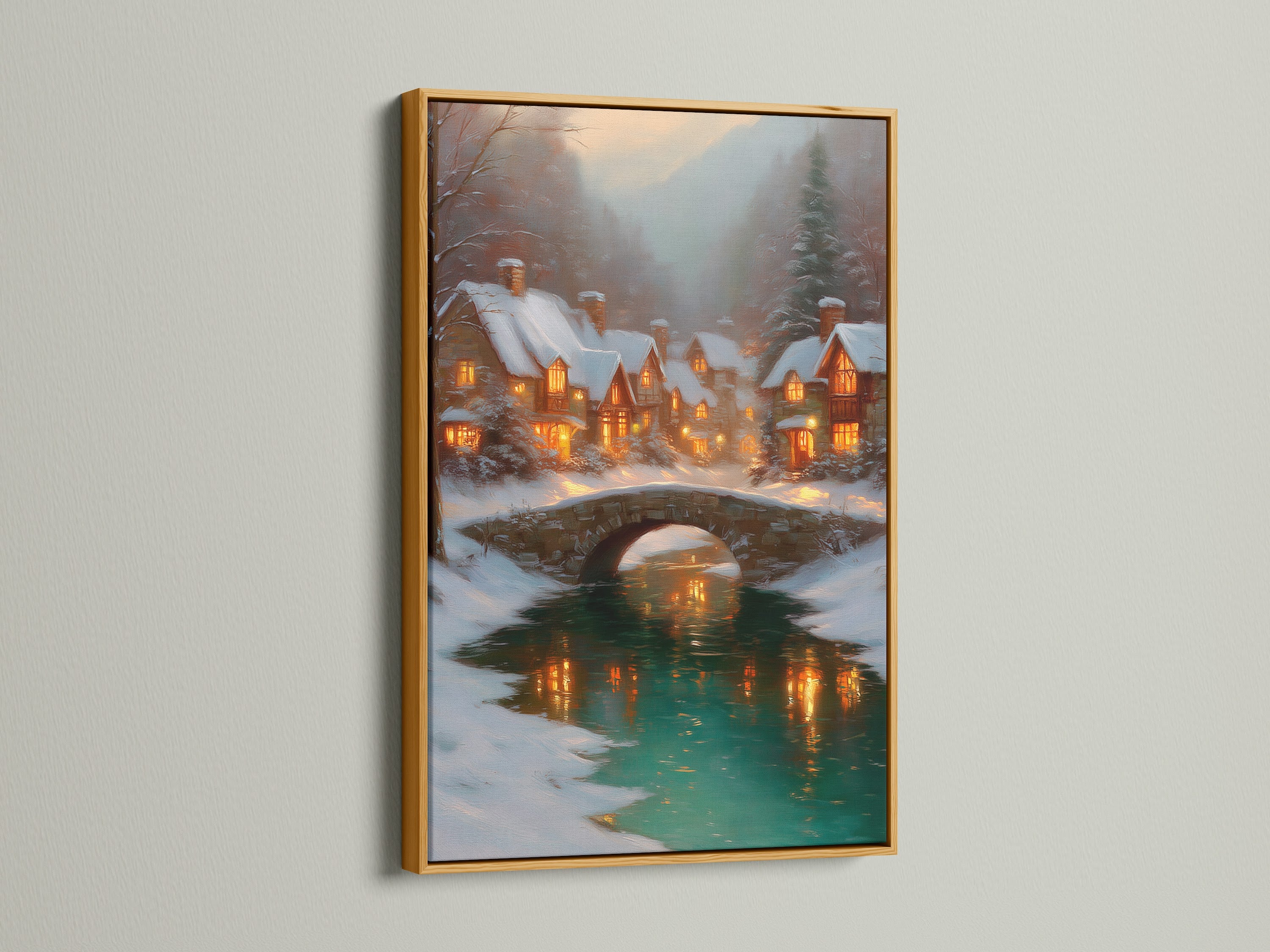 Winter Village artwork in a gold frame. The holiday home decor is enhanced by this winter village art. The bridge landscape adds a touch of elegance. This cozy cabin art brings a warm glow to any room. A beautiful snow village decor.
