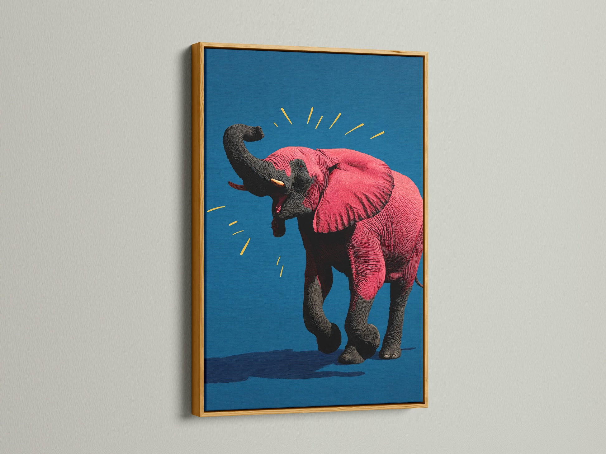 The pink elephant artwork is displayed in a luxurious gold frame. This contemporary animal canvas print brings a touch of elegance to any space. The vibrant pop art is perfect for adding a regal touch to a nursery or office. The gold frame enhances the artwork's vibrant colors.