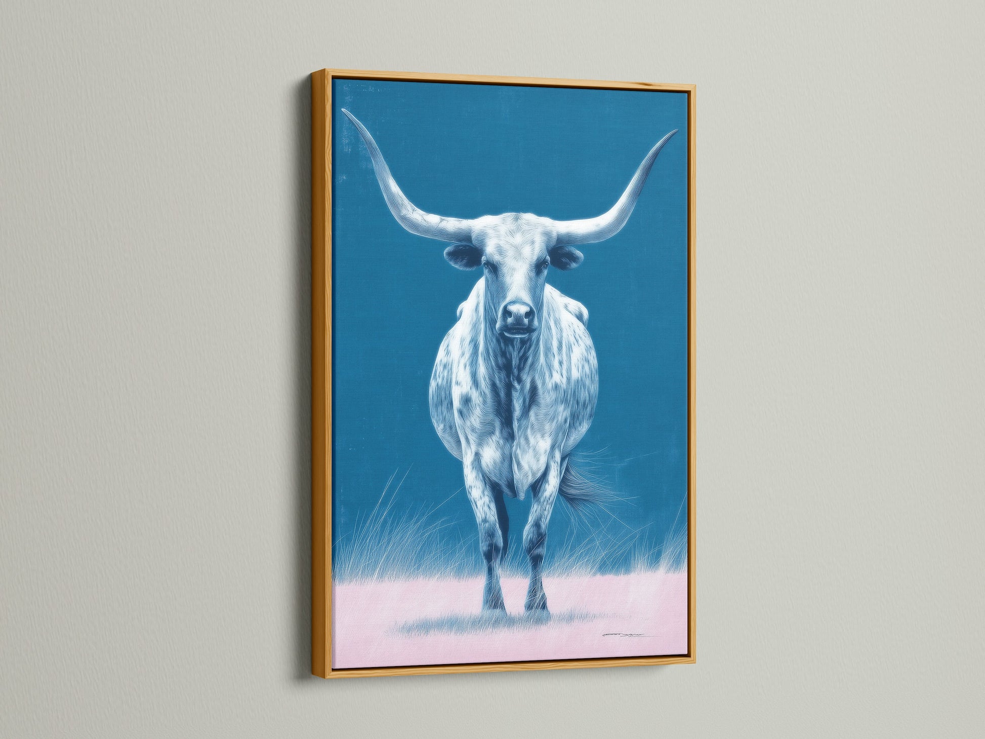 The longhorn bull artwork is featured in a gold frame. This piece of western artwork brings a touch of elegance to your space. The gold frame enhances the blue and pink hues. Perfect for a sophisticated look.
