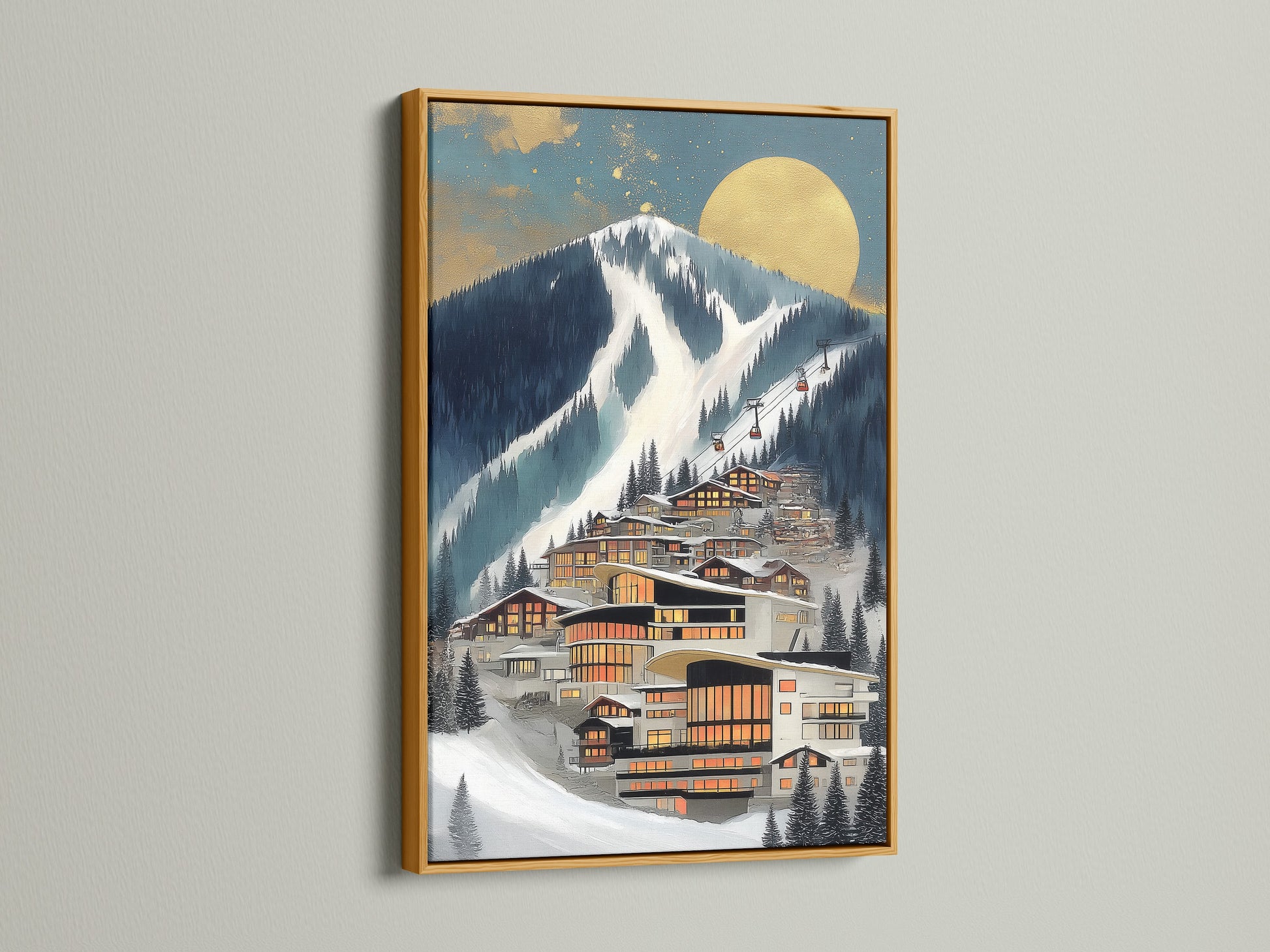 A framed Alpine Village artwork is displayed. The frame is gold. The wall art features a modern mountain ski resort. This contemporary canvas is ideal for interior decorators. It matches modern wall decor trends.