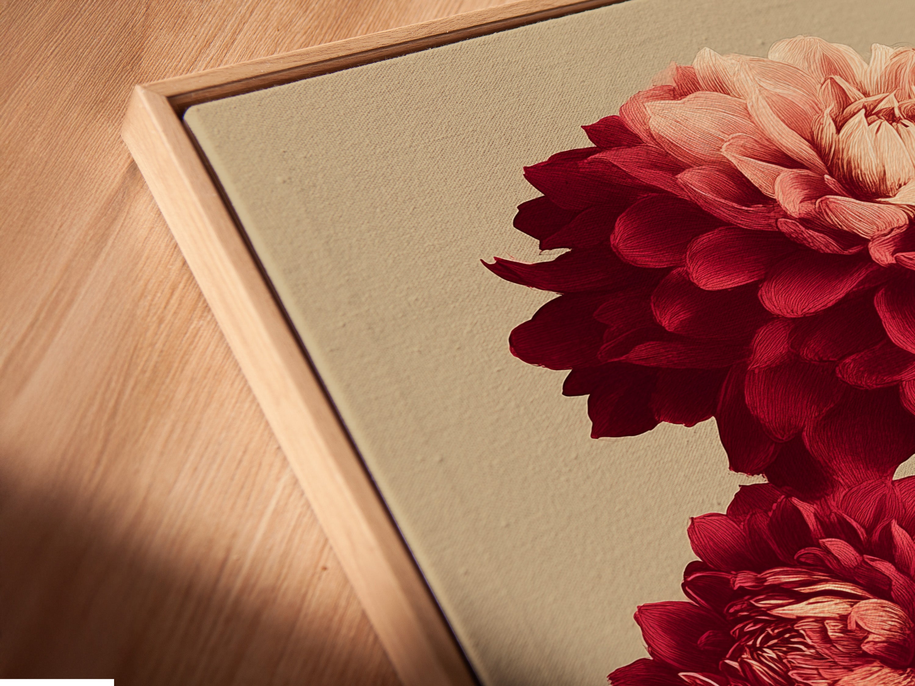 Close up angled view of a canvas print in a floating frame. This Dahlia Botanical Print is perfect for bedroom decor. It adds a touch of Victorian style. See the fine details of this red flower art.