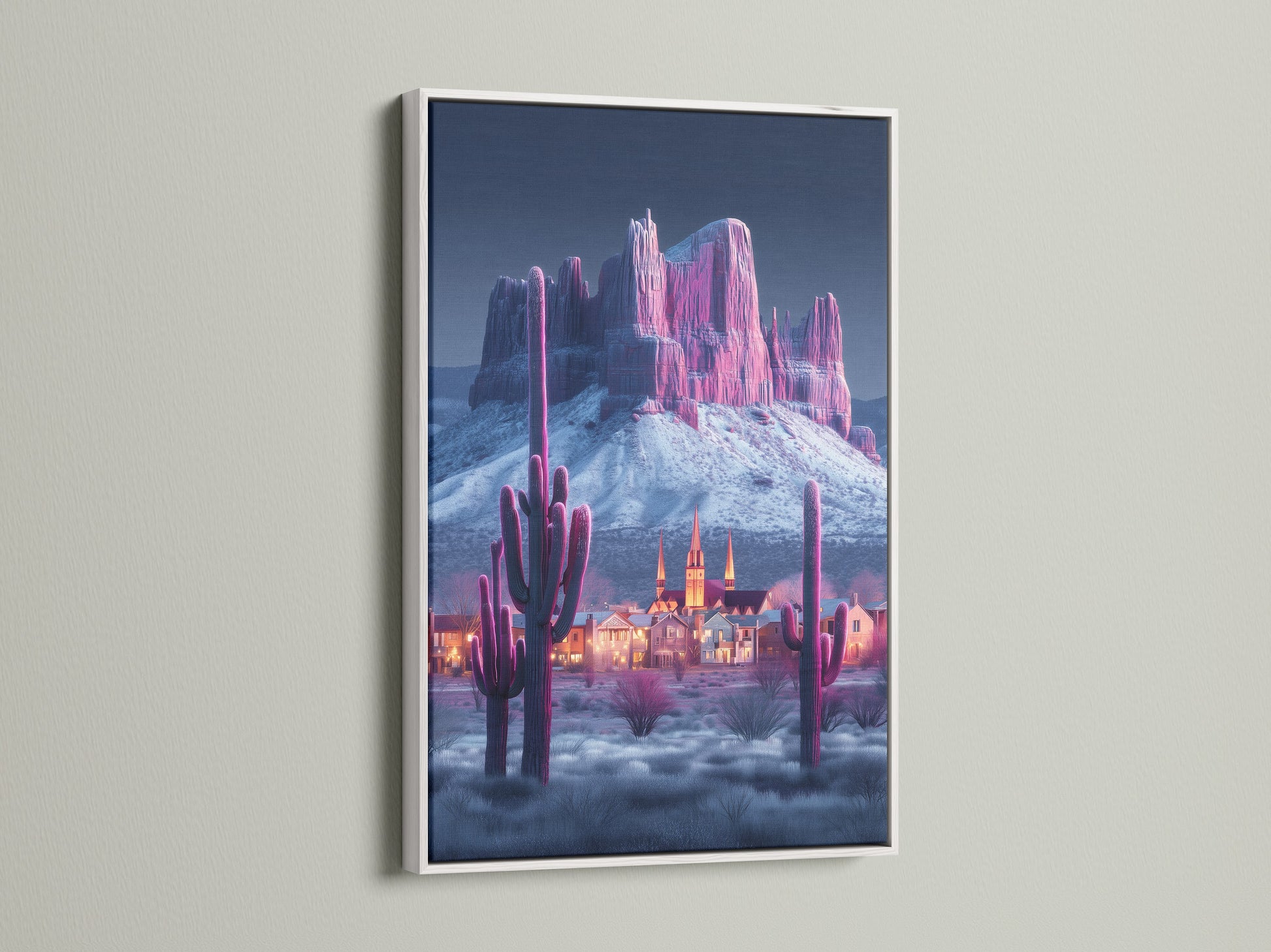 Modern Southwestern artwork. A pink cactus and mountain canvas print is displayed in a white frame. The artwork adds an elegant touch to your walls. Perfect for those seeking elevated art that fits modern styles.