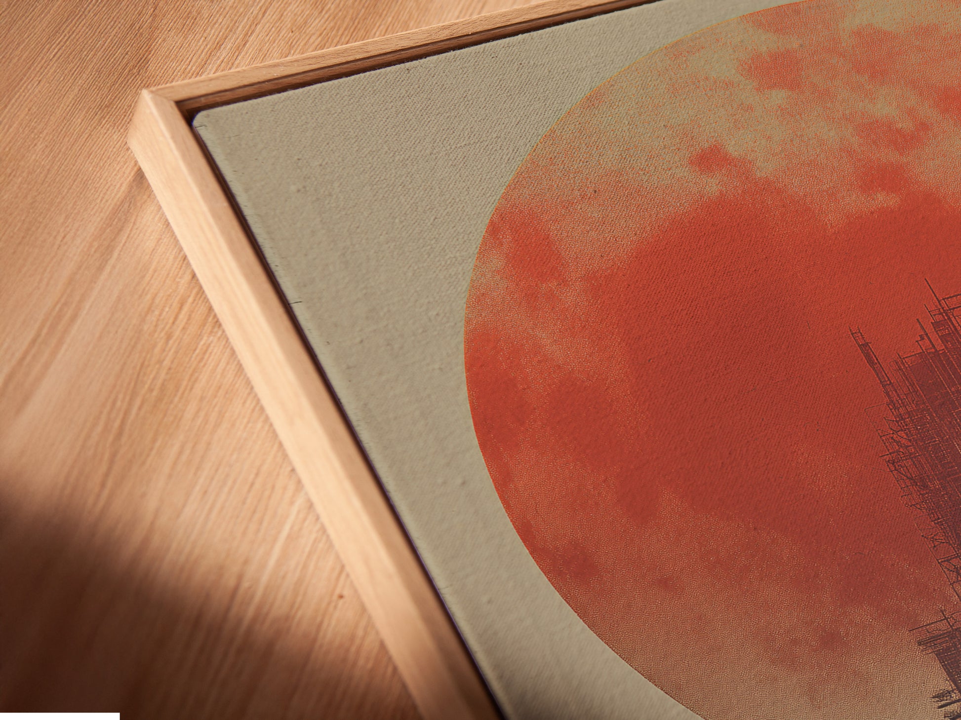 Angled close up shows a canvas print in a floating frame. The floating frame gives a modern touch. The canvas appears to float within the frame. See the detail and craftsmanship up close. Perfect for showcasing canvas art pieces. Add depth and dimension to your artwork.