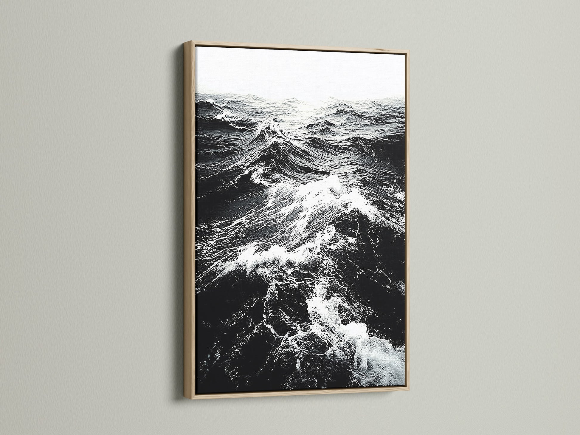This is an oak frame displaying black and white ocean wave artwork. The natural wood grain adds warmth to monochrome art. Perfect nautical decor for a modern home. Discover seascape canvas prints now.