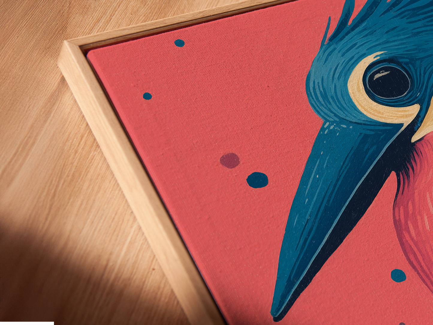 Close-up angled view of a canvas print in a floating frame. The Kingfisher bird artwork showcases vibrant pink and teal colors. This retro style wall art adds an elegant touch to any space. Perfect for modern or eclectic styles.