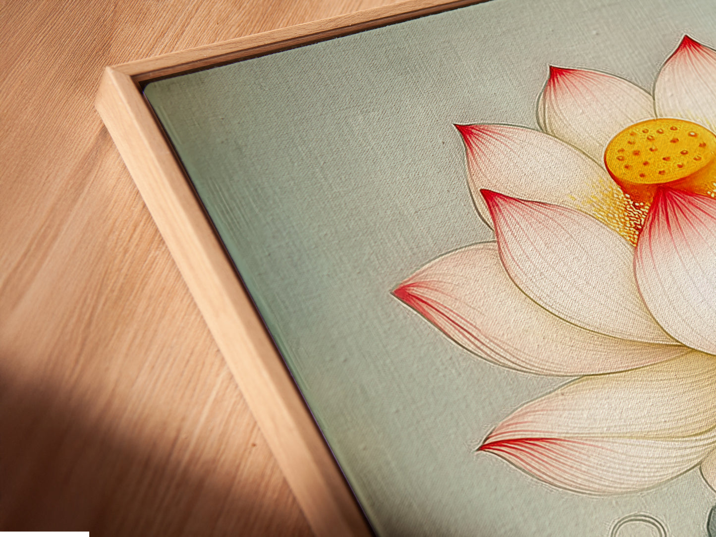 A close-up of a canvas print featuring Lotus Flower artwork in a floating frame. The botanical wall art is perfect for a study room. The teal floral artwork adds a touch of elegance. This Asian inspired art is a great choice.