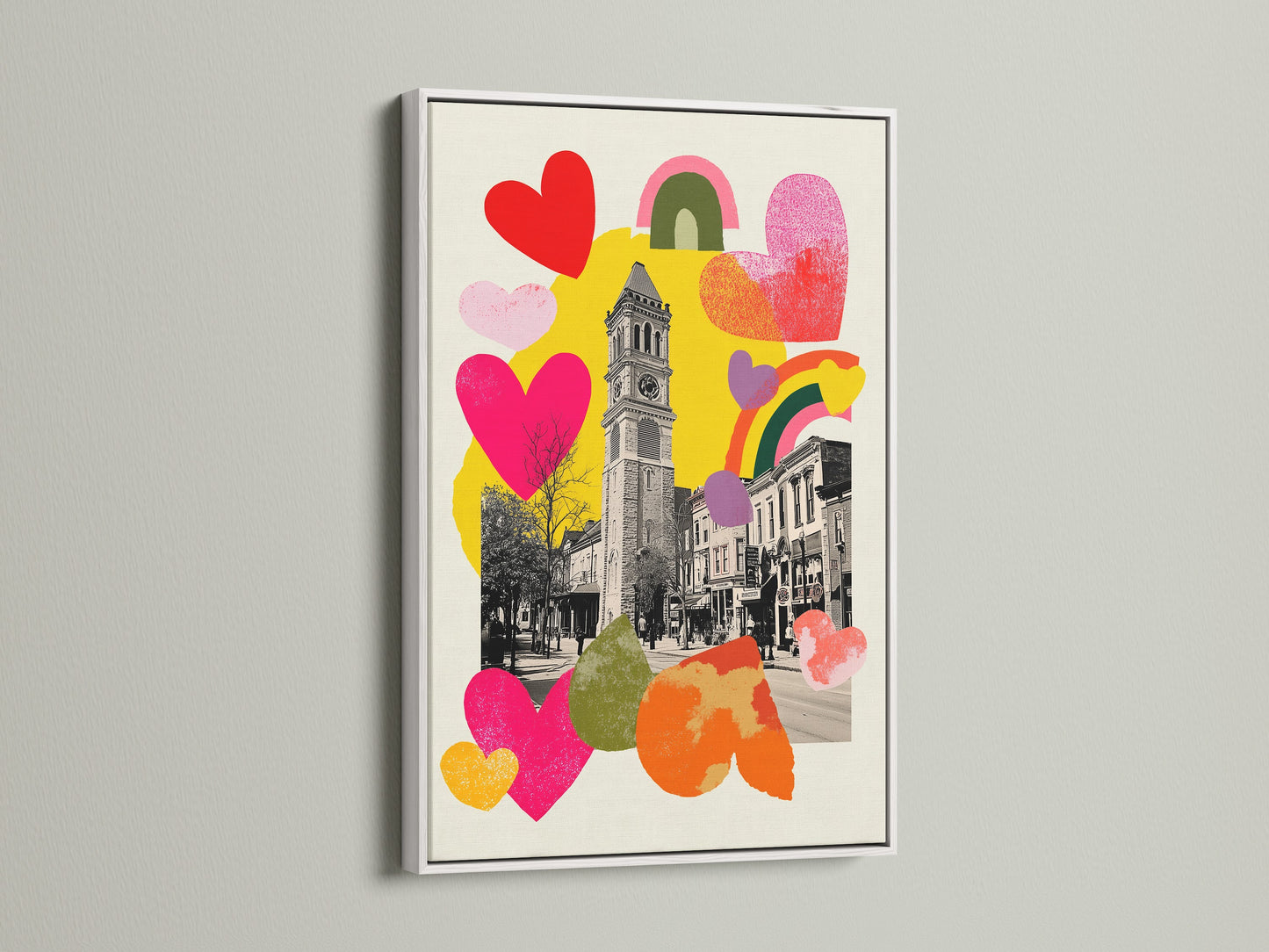 Artwork displayed in a white frame. The art features a clock tower. It also has colorful hearts and rainbows. The white frame offers a clean modern aesthetic. This framed artwork is versatile for any interior style. Find the perfect art to complement your space.