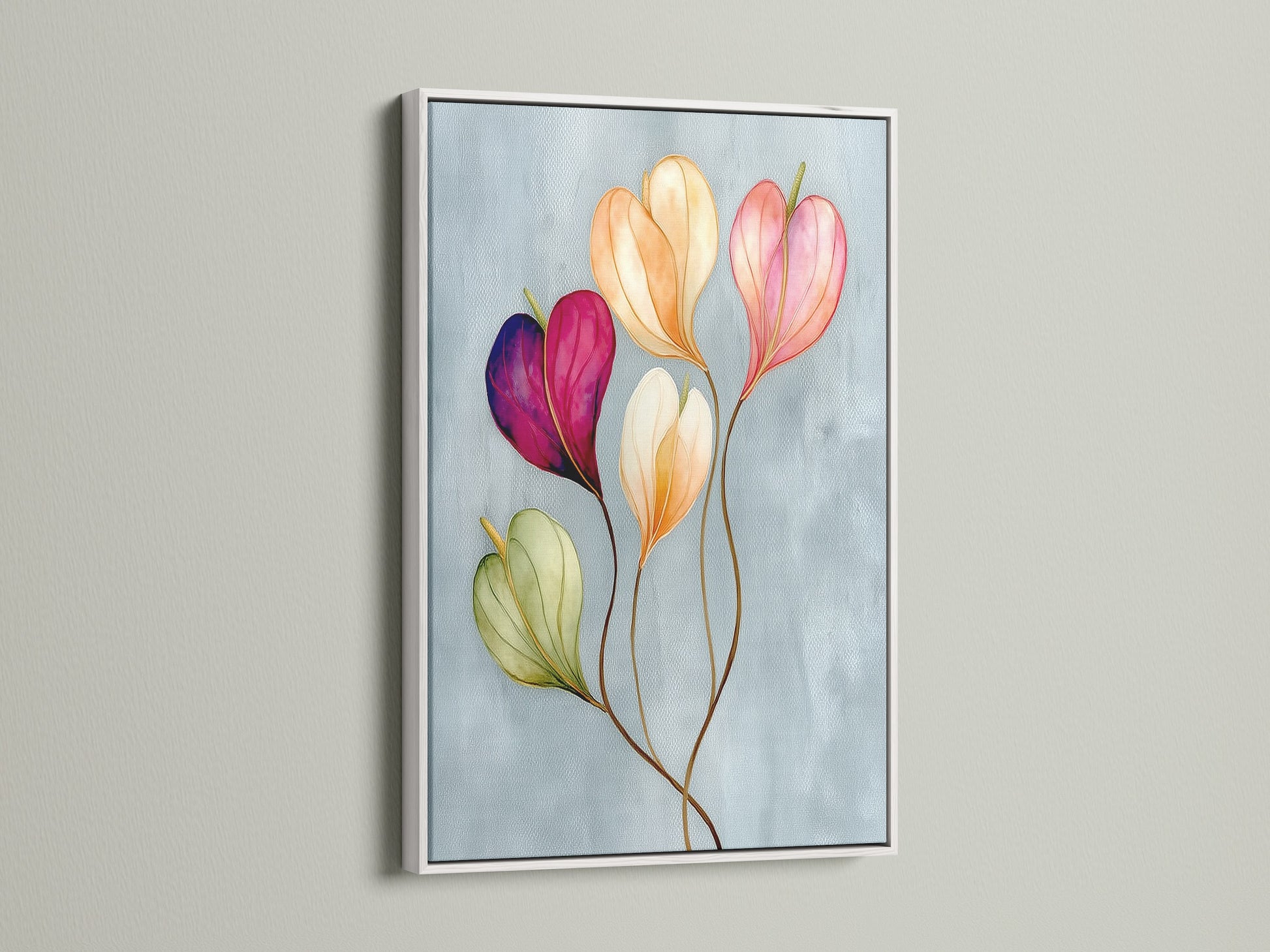 Floral watercolor canvas print in a white frame is displayed. This is a modern art print featuring a delicate flower artwork. The botanical canvas is ideal for adding a touch of spring to any room. This wall art print makes a thoughtful flower gift idea.