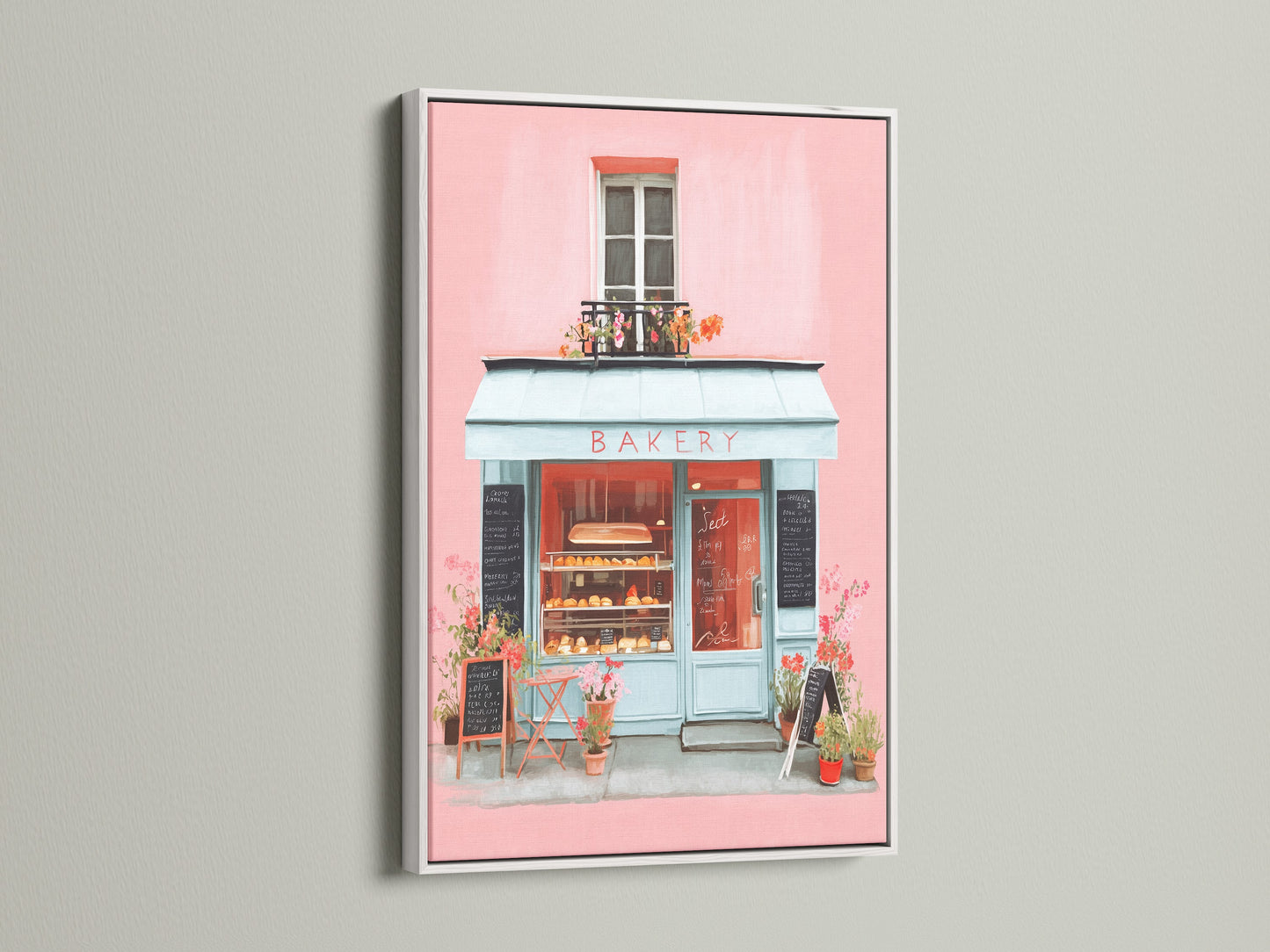 Artwork showcased in a white frame. The art features a delightful bakery scene painted in soft pinks and blues. The white frame provides a clean and modern look. This artwork will add a touch of elegance to any room. It is ideal for a serene atmosphere.