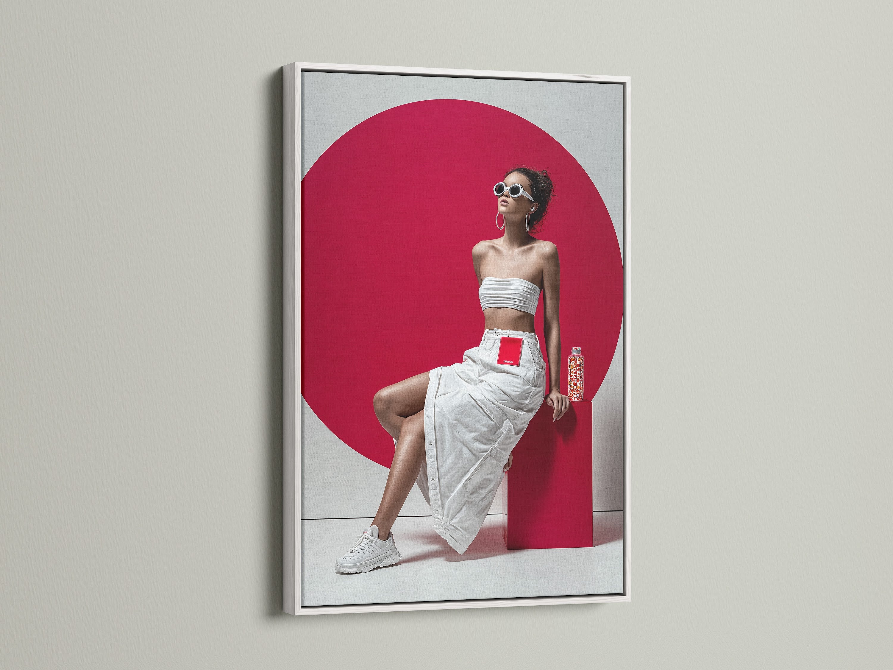 Pop art fashion artwork in a clean white frame. This contemporary portrait print showcases a stylish model in white against a red backdrop. The white frame enhances the modern aesthetic. It's perfect for a trendy bedroom wall or a minimalist space.