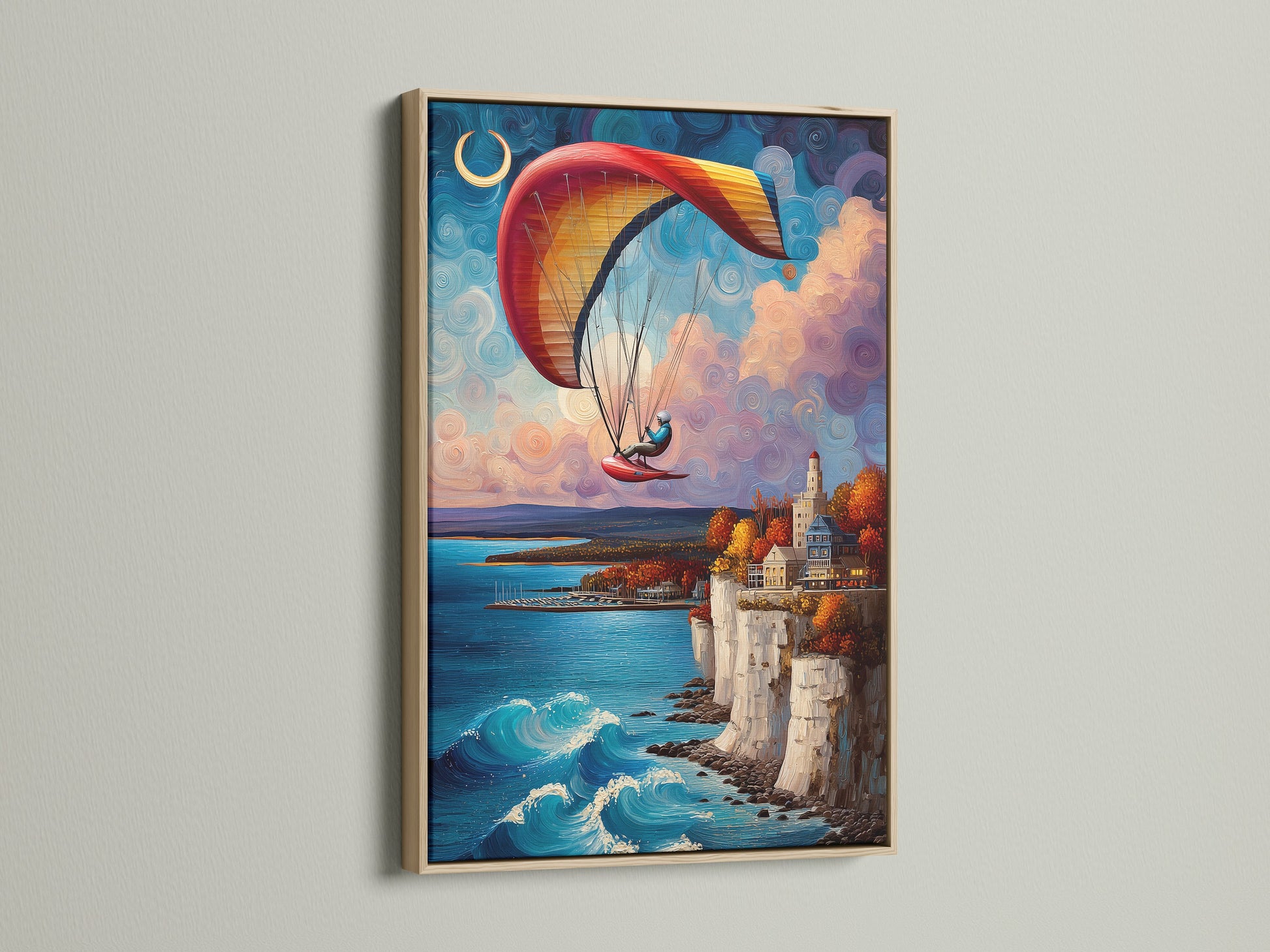The paragliding artwork is framed in a light oak wood. The artwork features a coastal cliffside scene with a paraglider in the sky. The artwork displays a blend of blue waters and whimsical clouds. Perfect for coastal-themed spaces. The oak frame enhances the artwork's natural beauty. It is a captivating piece for any art lover.