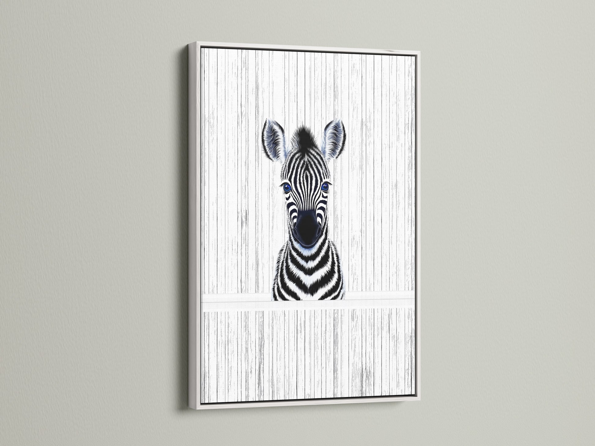 A delightful Baby Zebra artwork in a white frame. The black and white animal art complements kids room decor. This zebra poster brings a minimalist touch to a safari nursery. The white frame adds a clean contemporary look.