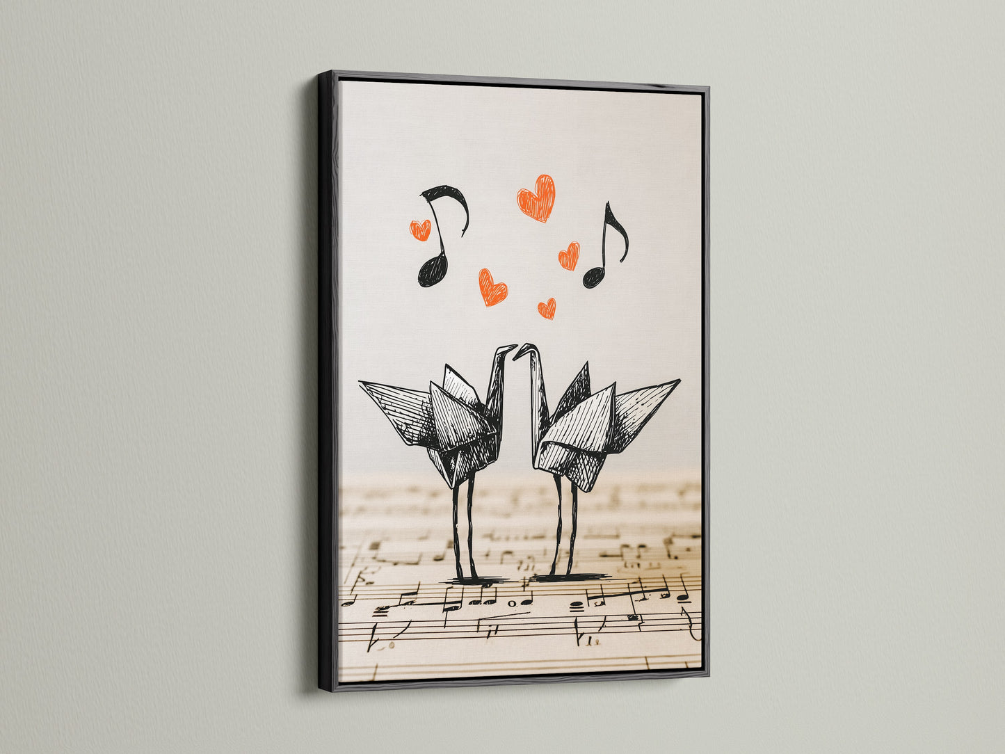 Black framed origami cranes artwork on display. The artwork features two origami cranes on a music sheet. Red hearts and music notes float above. The black frame provides a bold contrast to the minimalist art.