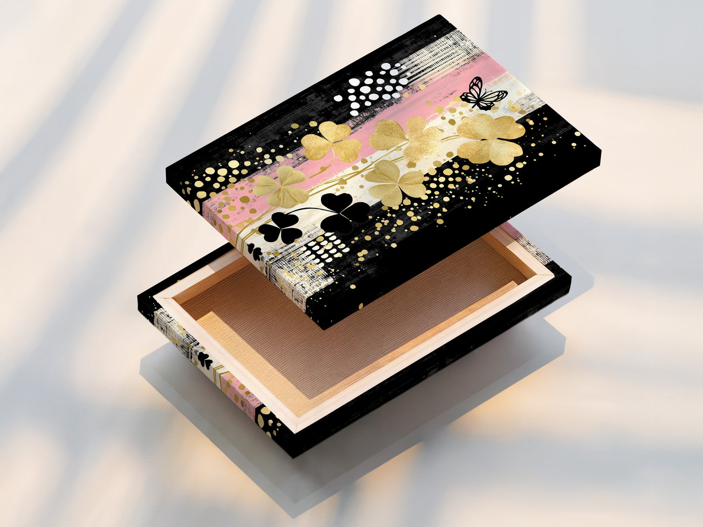 A stretched canvas print of the Clover Canvas Print art. This ready-to-hang modern botanical artwork is perfect for instant wall decor. Add a touch of gold and black floral art to your home.