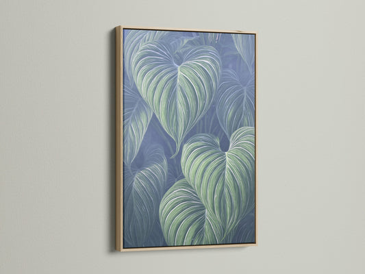 This is a tropical leaf art piece in an oak frame. The blue green botanical wall art adds a modern touch. It's great plant art for any room. The oak frame enhances this nature canvas art.