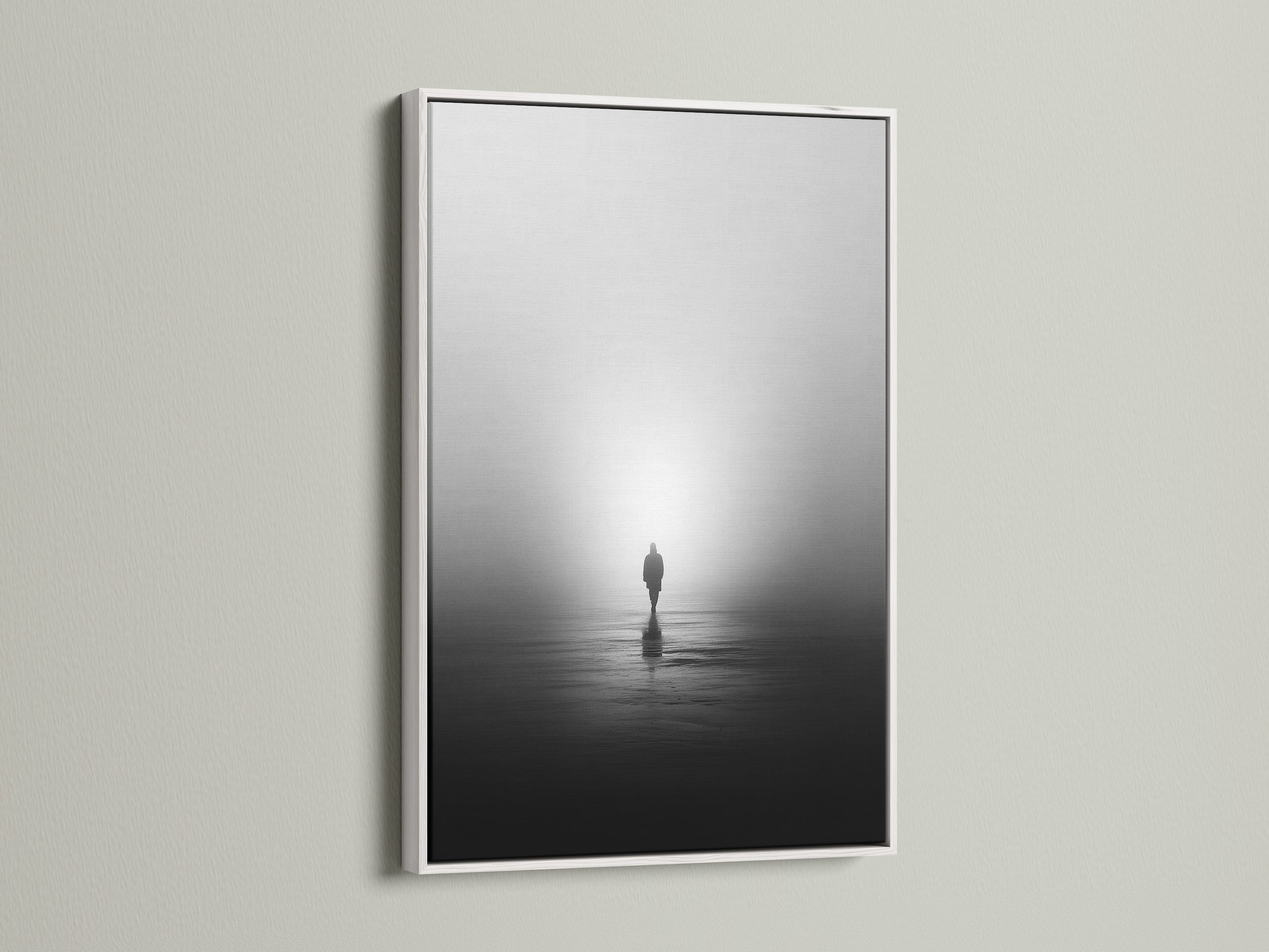 A white frame surrounds this minimalist solitude canvas print. The black and white artwork captures a foggy water reflection. Ideal for a peaceful artwork display. It complements contemporary wall decor.