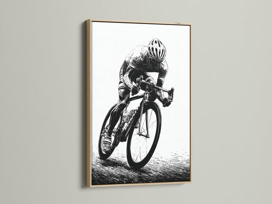 A cycling art print is displayed in an oak frame. This black and white sports canvas print is perfect for home gym and office decor. Cyclist artwork adds an athletic touch to any room. A vintage cycling art piece.