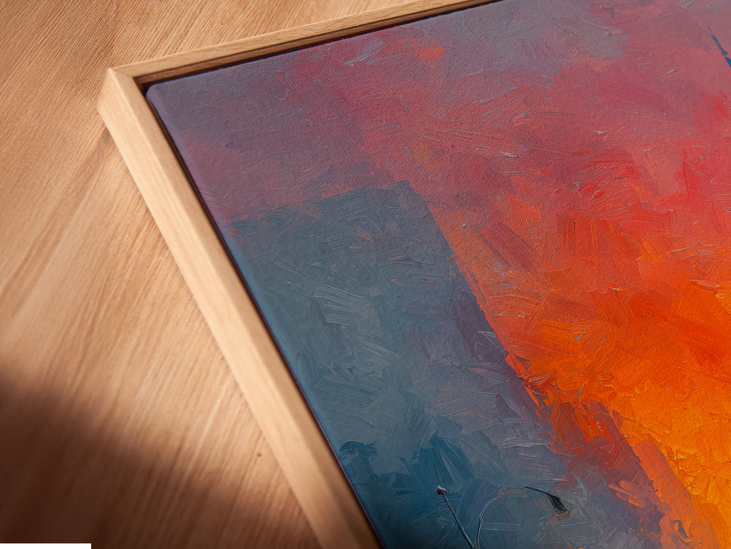 A close-up of a canvas print displayed in a floating frame. The floating frame gives the artwork a modern gallery look. The warm sunset tones and urban details are highlighted. This cityscape artwork is perfect for a contemporary space. A stylish addition to any wall.