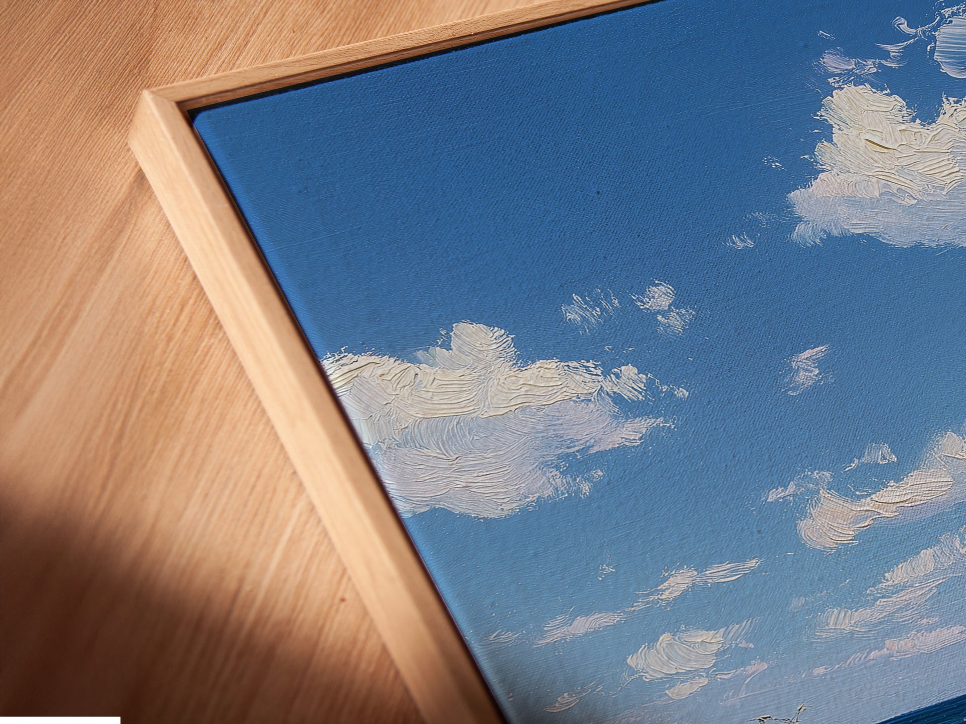 Close-up angled view of a canvas print in a floating frame. This modern framing option enhances the artwork. The floating frame adds depth and sophistication. Perfect for contemporary interiors.