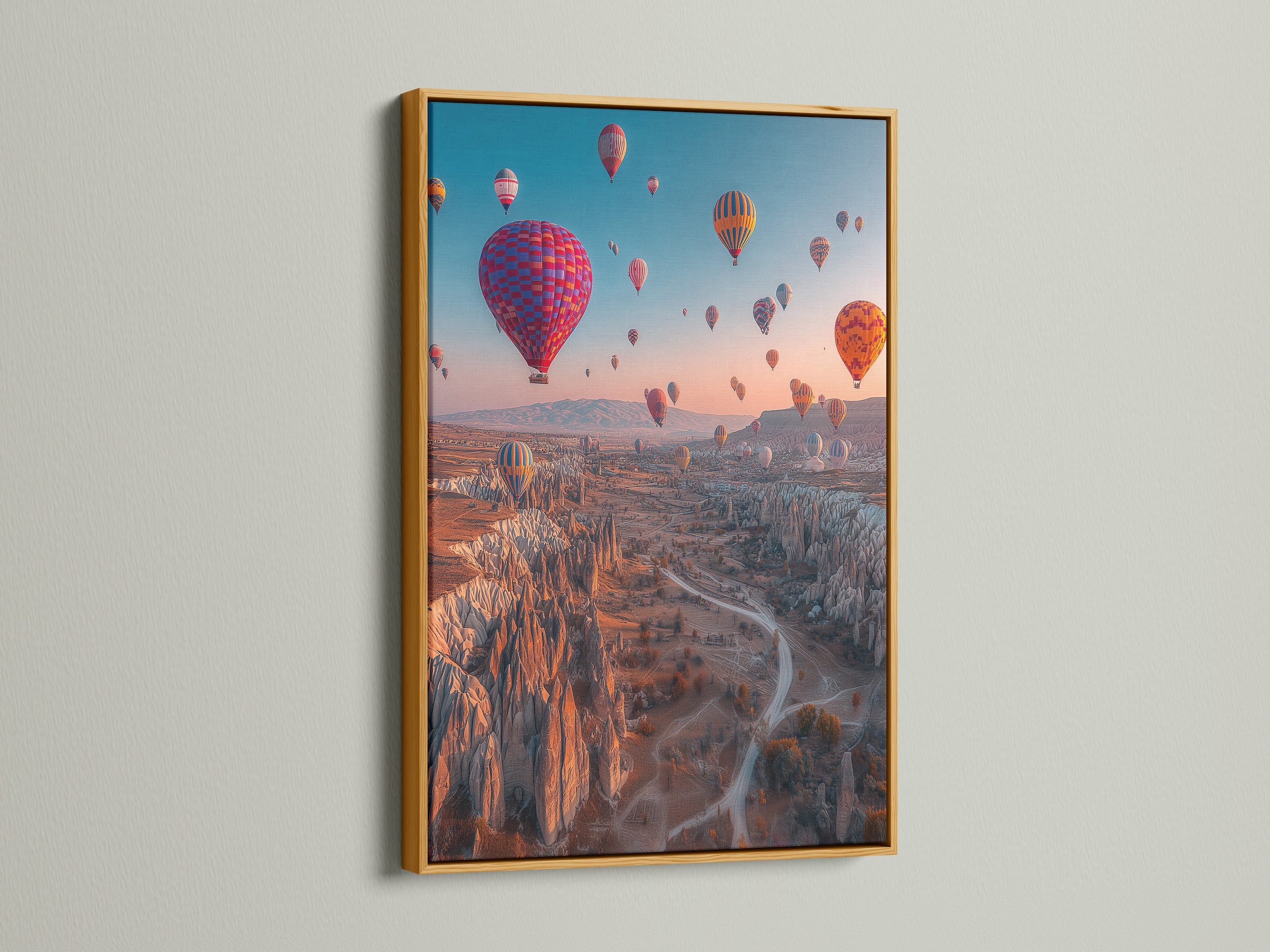 A gold frame adds a touch of luxury to this Cappadocia print. The travel wall art becomes a statement piece. It enhances bohemian and eclectic decor styles. The gold frame elevates this adventure decor.