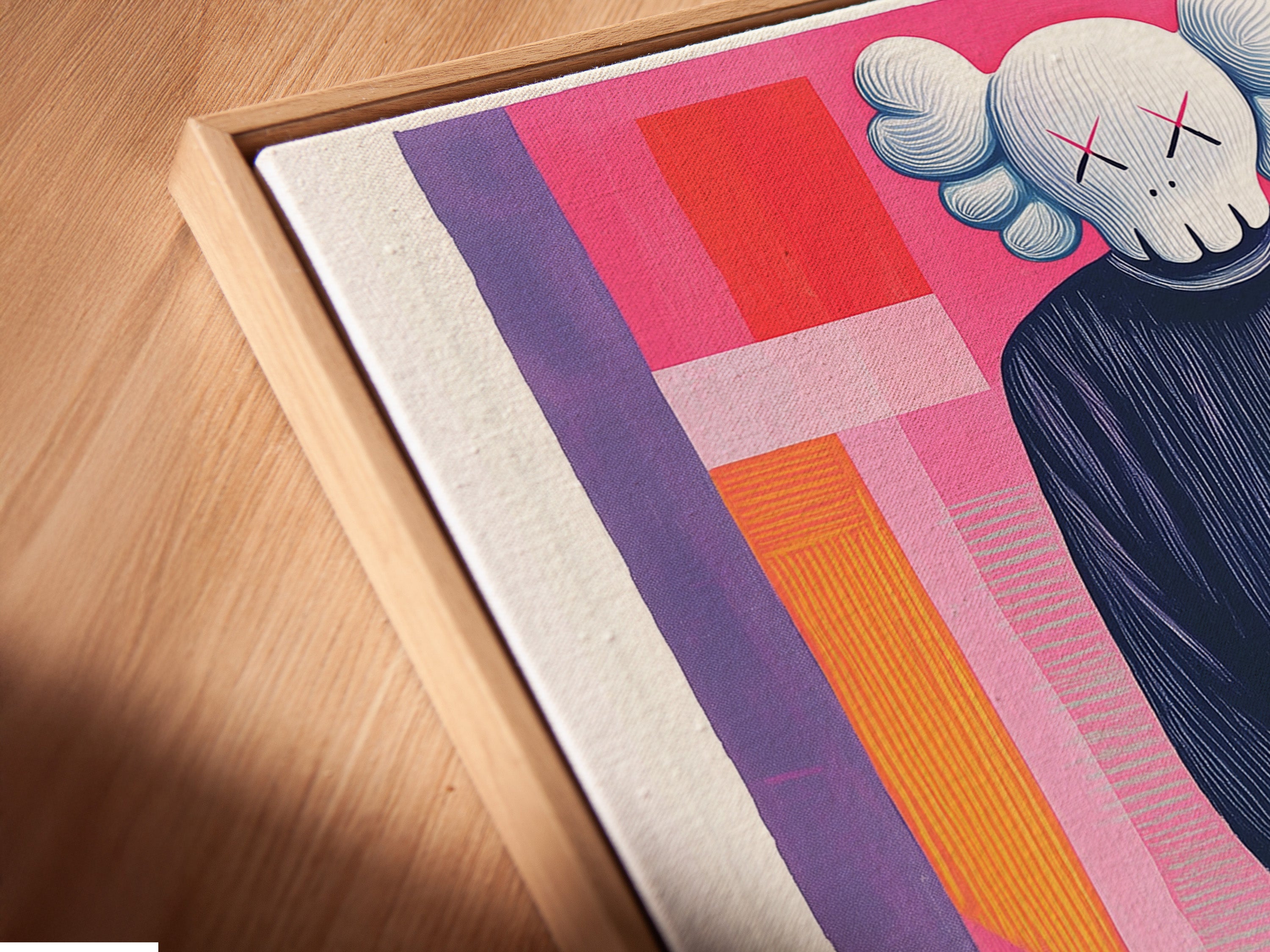 A close-up angled view shows a canvas print in a floating frame. The frame enhances the artwork's depth. The floating frame gives the art a modern look. The artwork is mounted on a white wall. The canvas texture adds to the artwork's visual appeal.