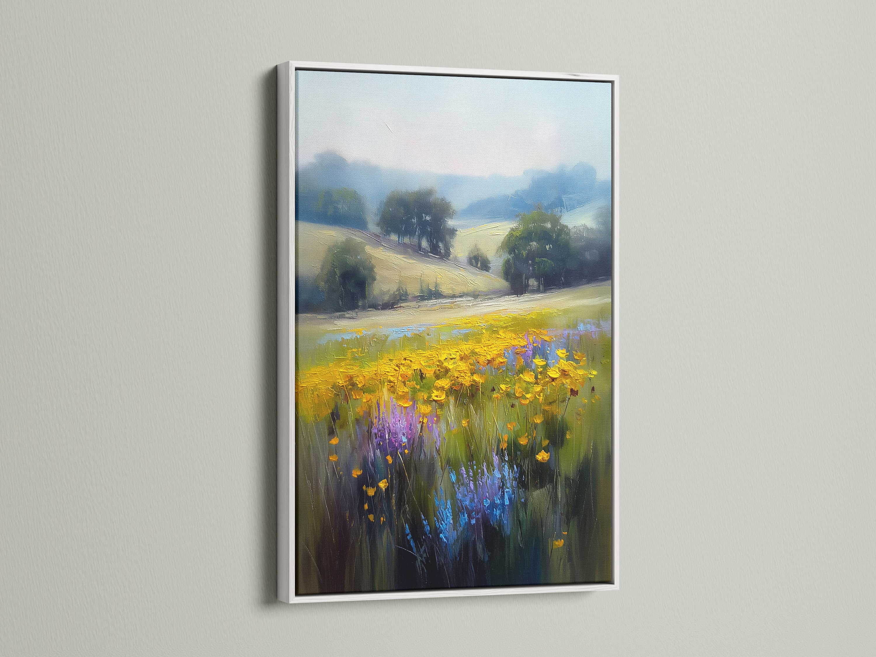 The wildflower meadow artwork is elegantly presented in a white frame. The floral wall art enhances the beauty of any space. The yellow flowers and purple blooms create a vibrant country landscape. Perfect for adding a touch of nature to your bedroom or living room wall decor.