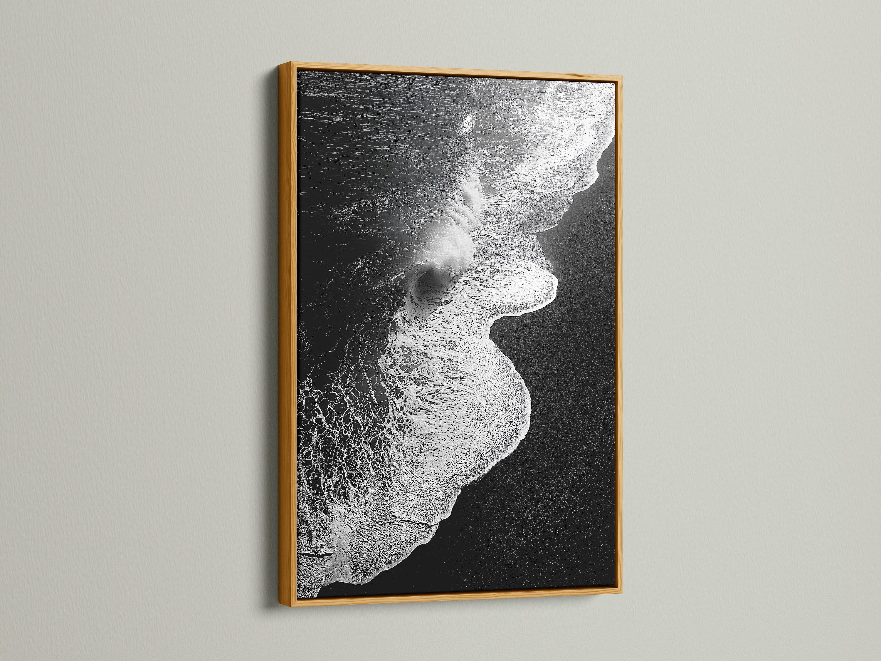 This is a black and white ocean wave artwork print. It is presented in a gold frame. This exquisite piece is perfect for adding a touch of elegance. It is minimalist decor. The beach canvas print enhances any space. Ideal for those seeking refined coastal wall art. Perfect for living rooms bedrooms and offices.