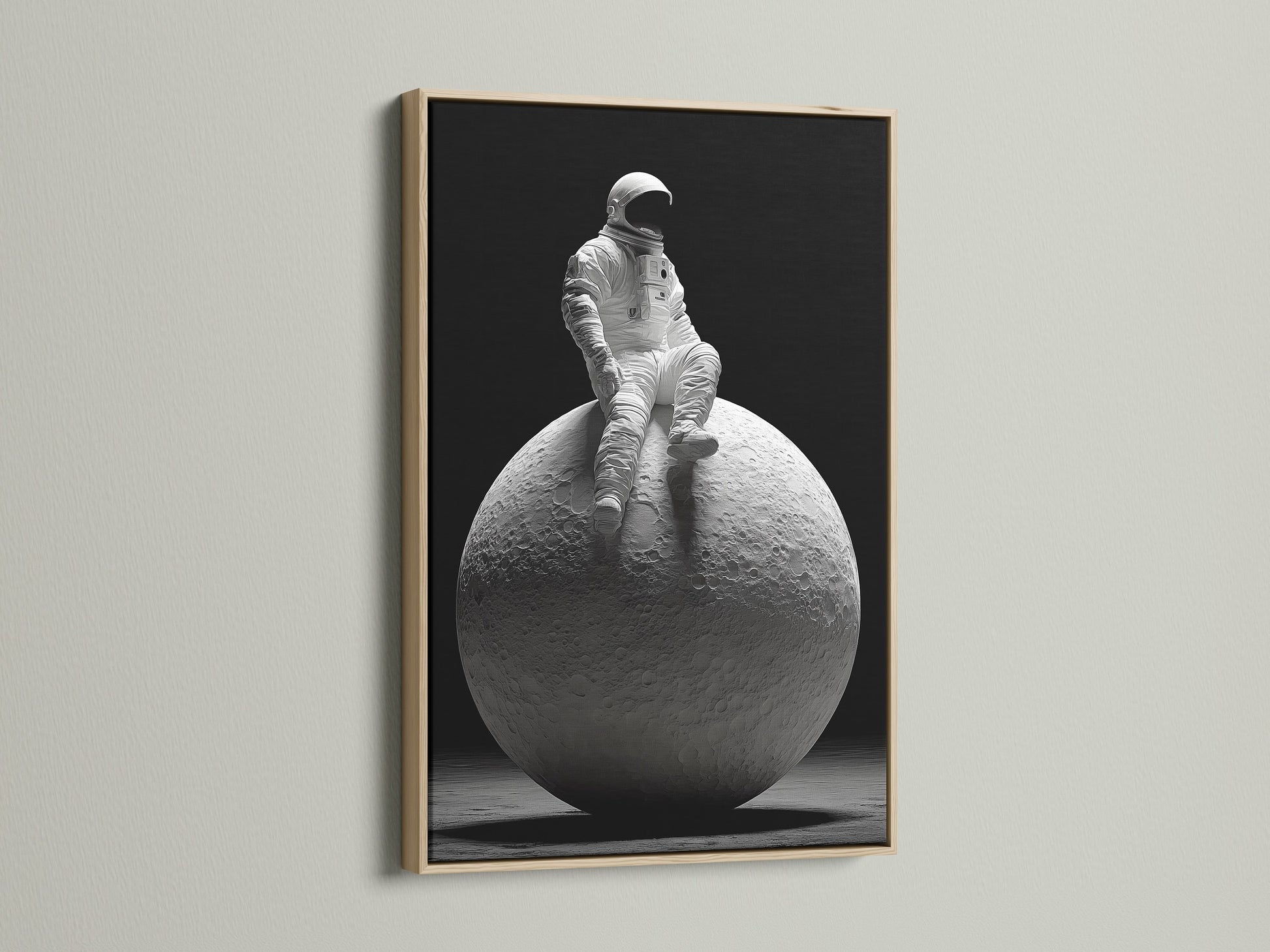 A modern art print features an astronaut perched on the moon. The print is encased in a beautiful oak frame. The natural wood grain enhances the artwork. This framed art print adds a touch of sophistication to any room.