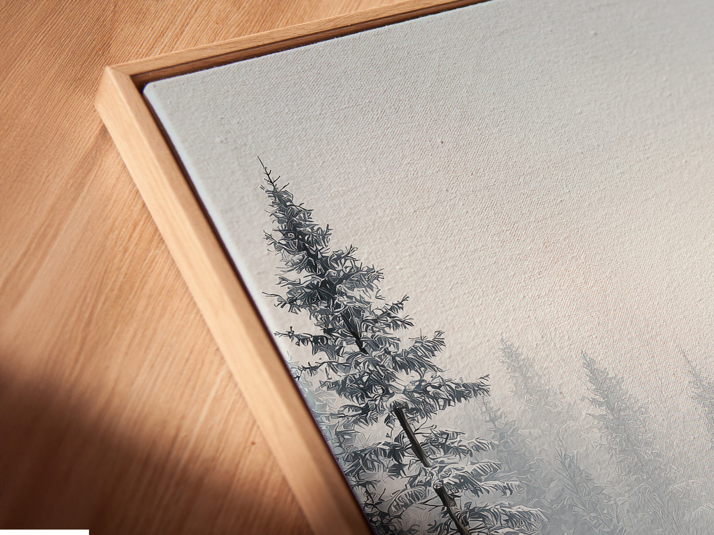 Angled close-up of a Winter Forest canvas print in a floating frame. The artwork displays snow-covered pine trees. A cozy cabin is seen in the winter landscape. This contemporary framing enhances the artwork's appeal. Ready to hang.