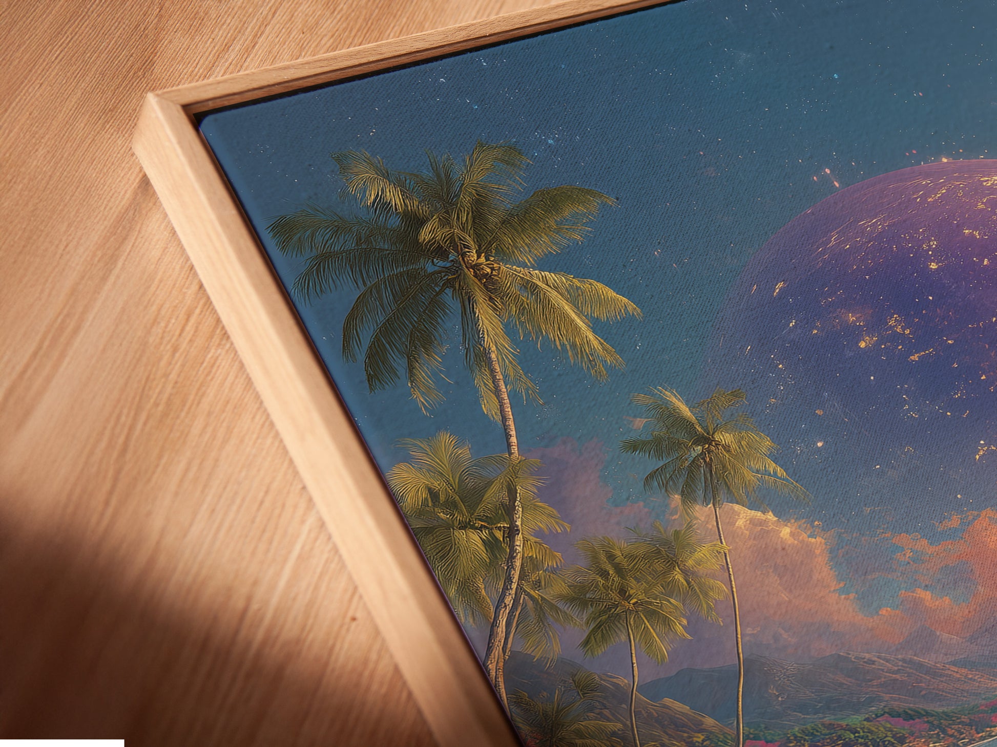 A close-up angled view of a canvas print in a floating frame. The artwork features a woman in a yellow dress on a beach with a planet in the sky. The floating frame gives the art a modern look. This adds depth to the piece.