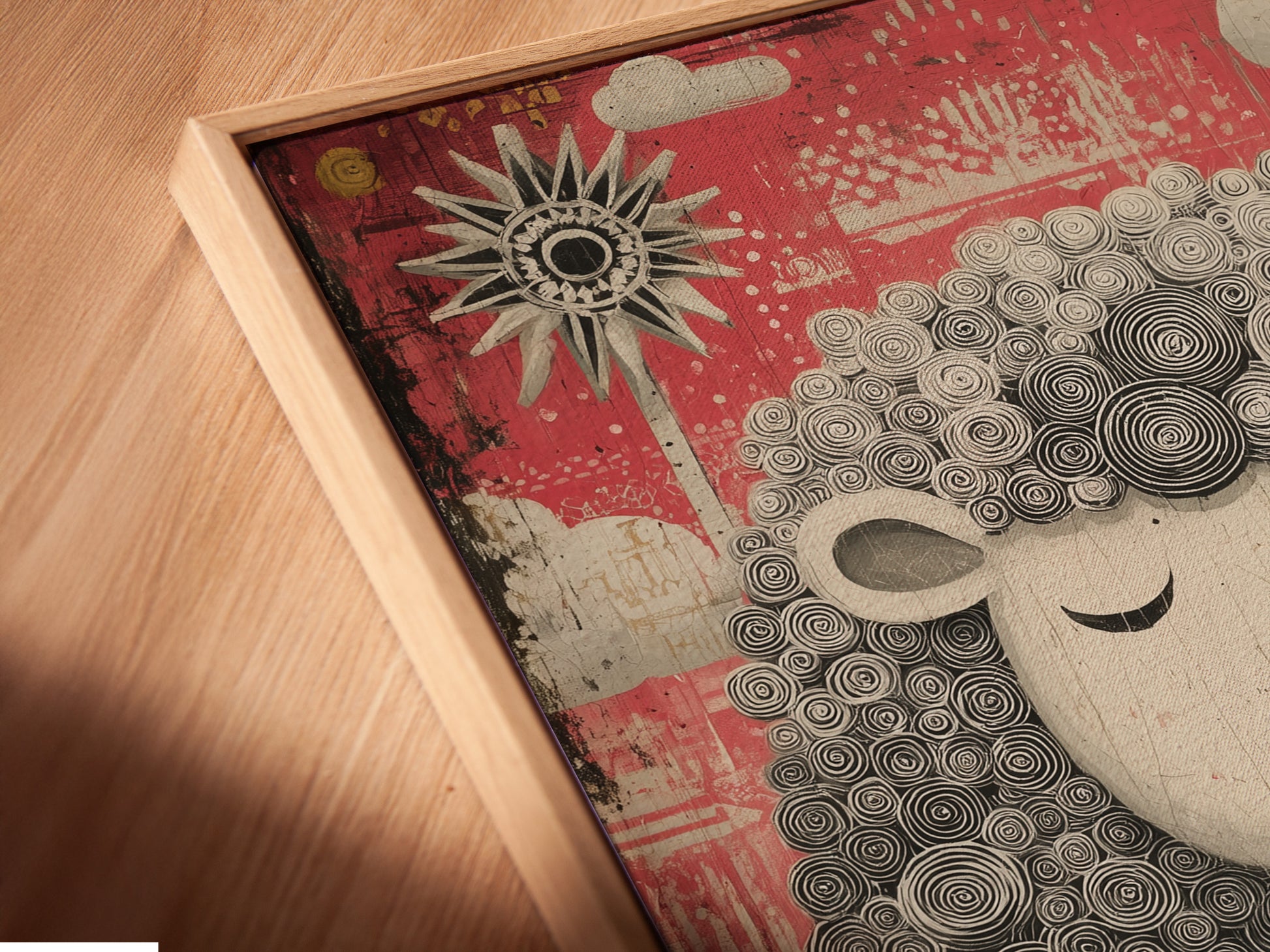 Angled close-up reveals a canvas print in a floating frame. The artwork features a black and white sheep. The sheep is set against a pink backdrop. Clouds and suns decorate the background. The floating frame adds depth to the artwork.