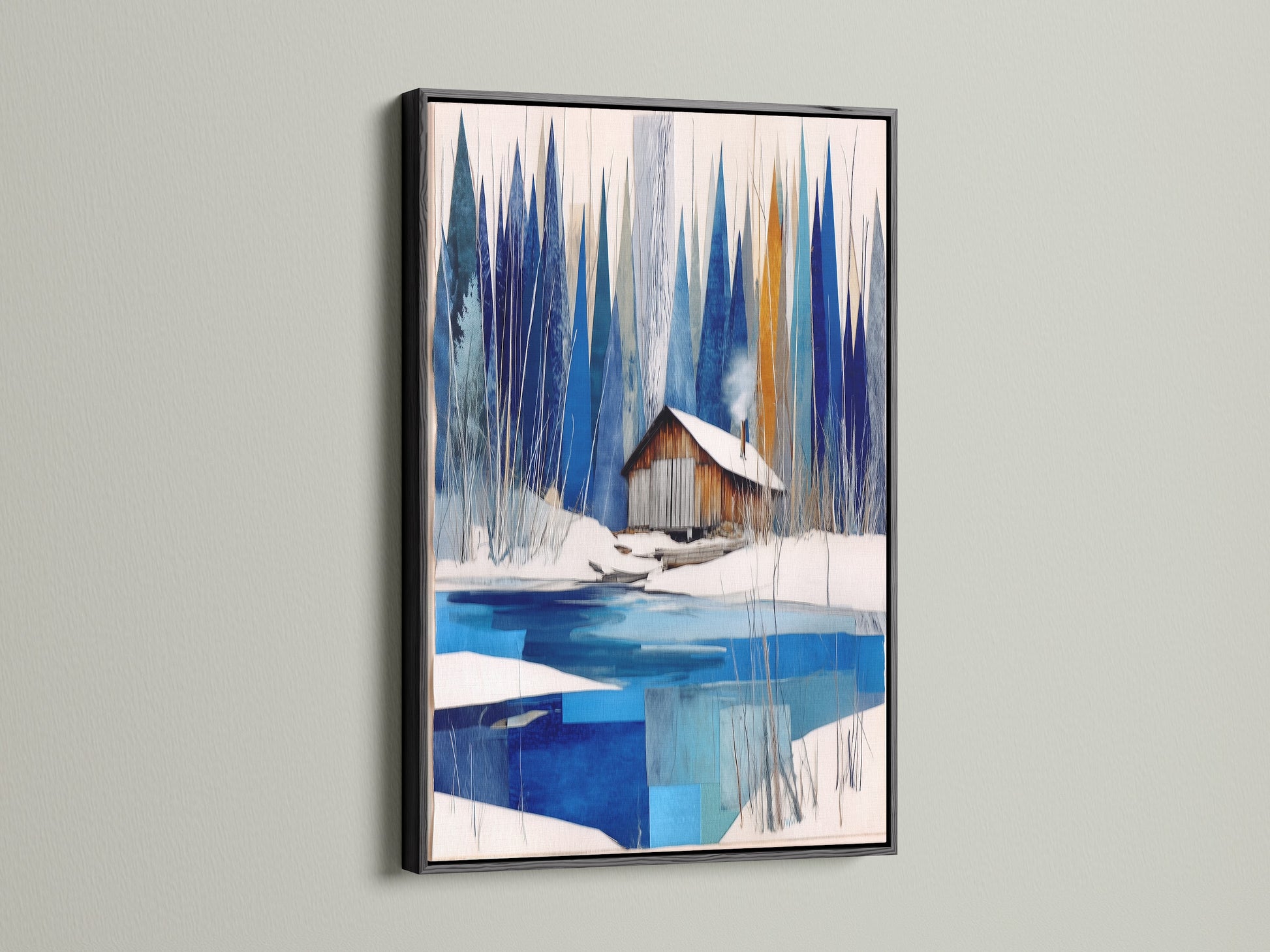 Winter Cabin Canvas Artwork with a black frame. Showcases snowy lake wall art for chalet decor. The black frame provides a bold contrast to the blue and white abstract winter art. Elevates modern wall art in any nature print collection. A stylish addition to lake house decor or ski lodge art.