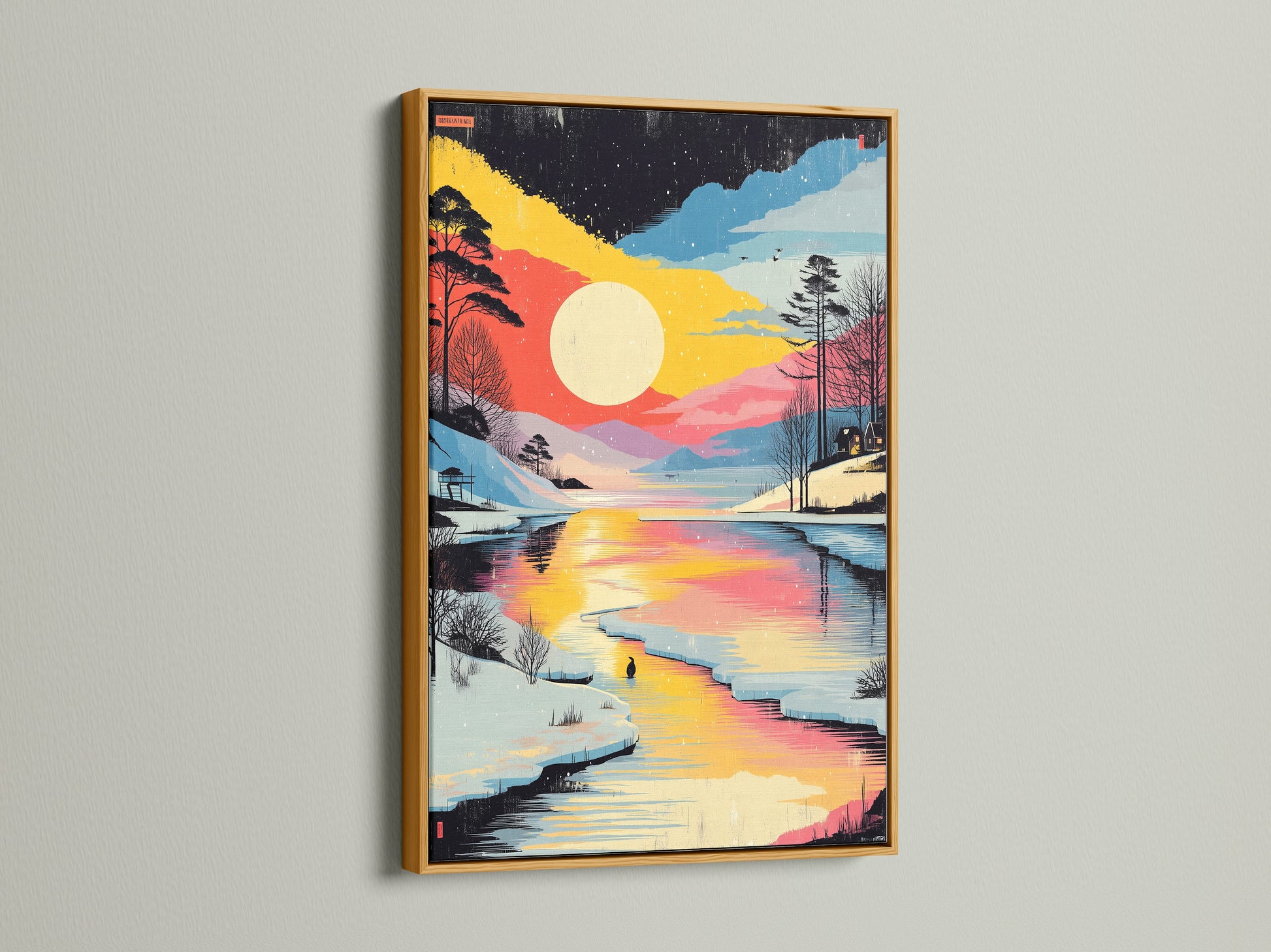 Winter Sunset Canvas Print in a gold frame. This artwork displays a vibrant lake landscape. Snowy forest artwork complements any room. Elevate your space with this stunning canvas print.