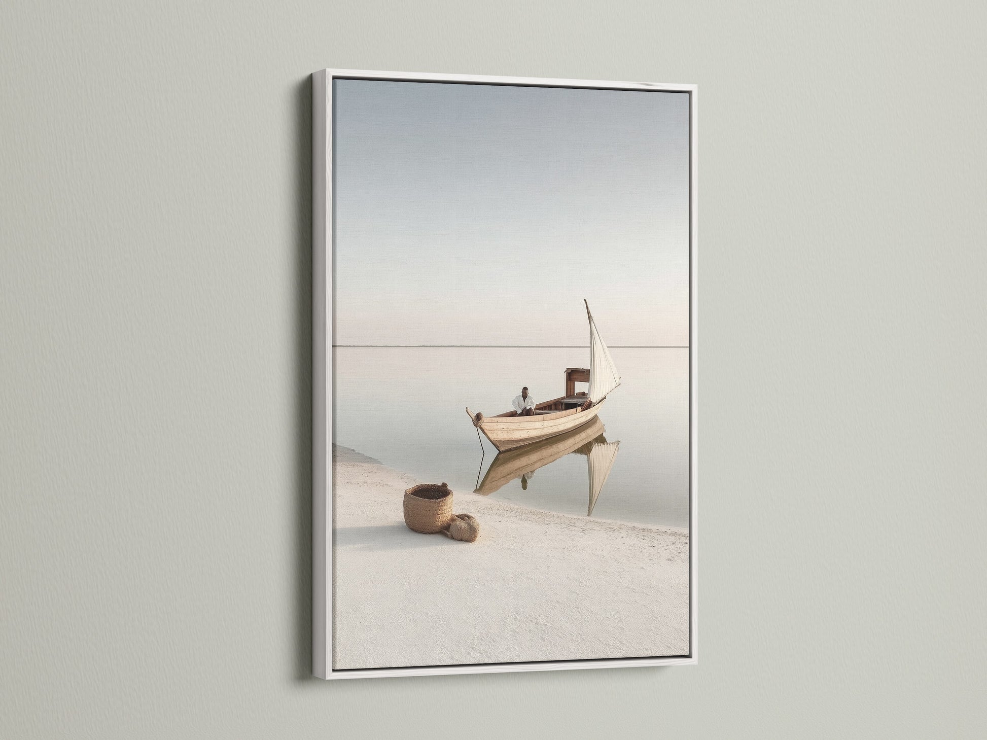 Nautical Wall Decor in a white frame. This serene art piece captures a beautiful seascape. Perfect for adding a touch of the coast to your home. The white frame enhances the minimalist aesthetic.