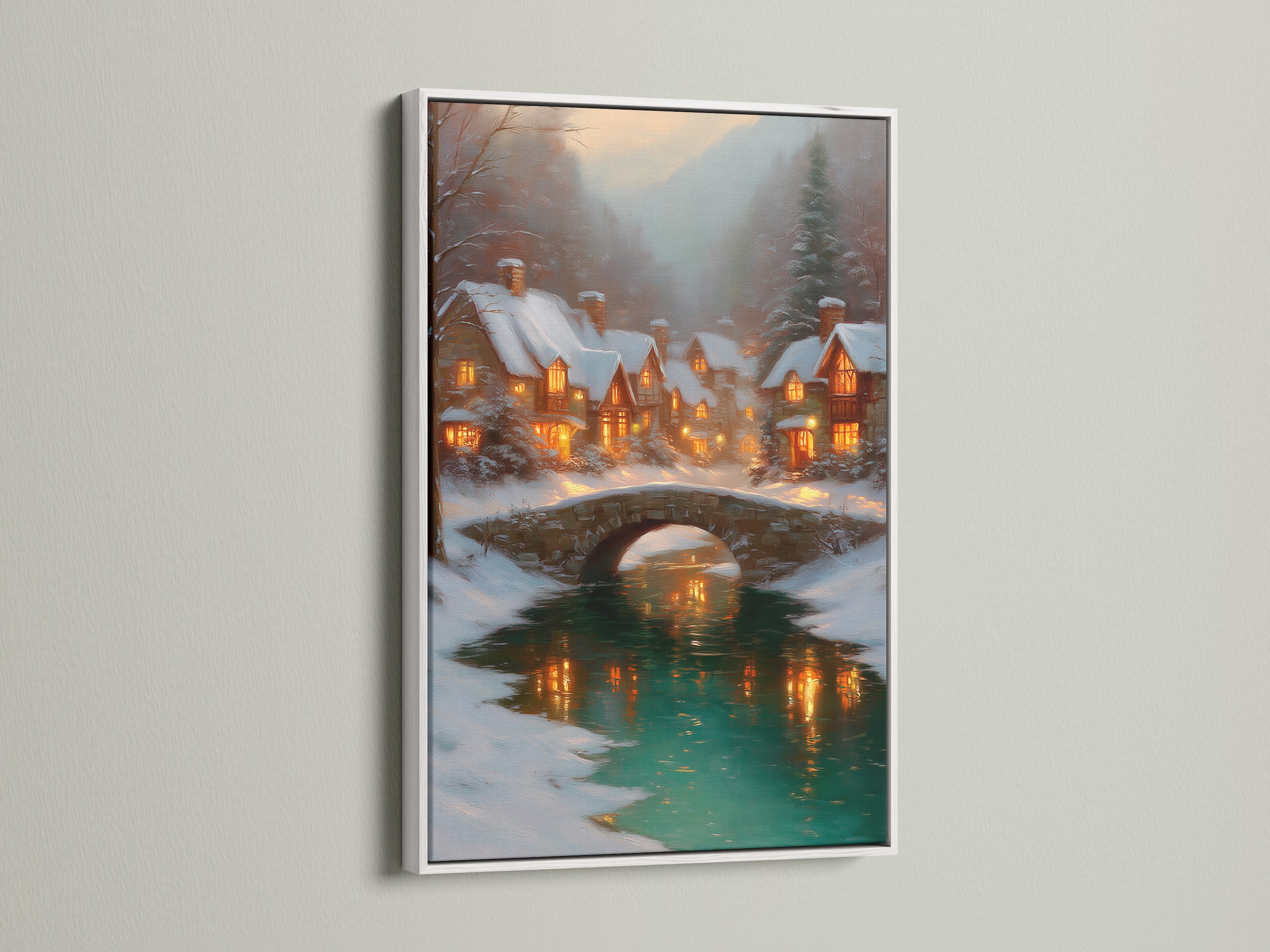 Winter Village artwork in a white frame. This Christmas wall art showcases a snow village decor. The bridge landscape adds a touch of warmth to your living room wall. Ideal for holiday home decor or a cozy nook. A festive wall decor.
