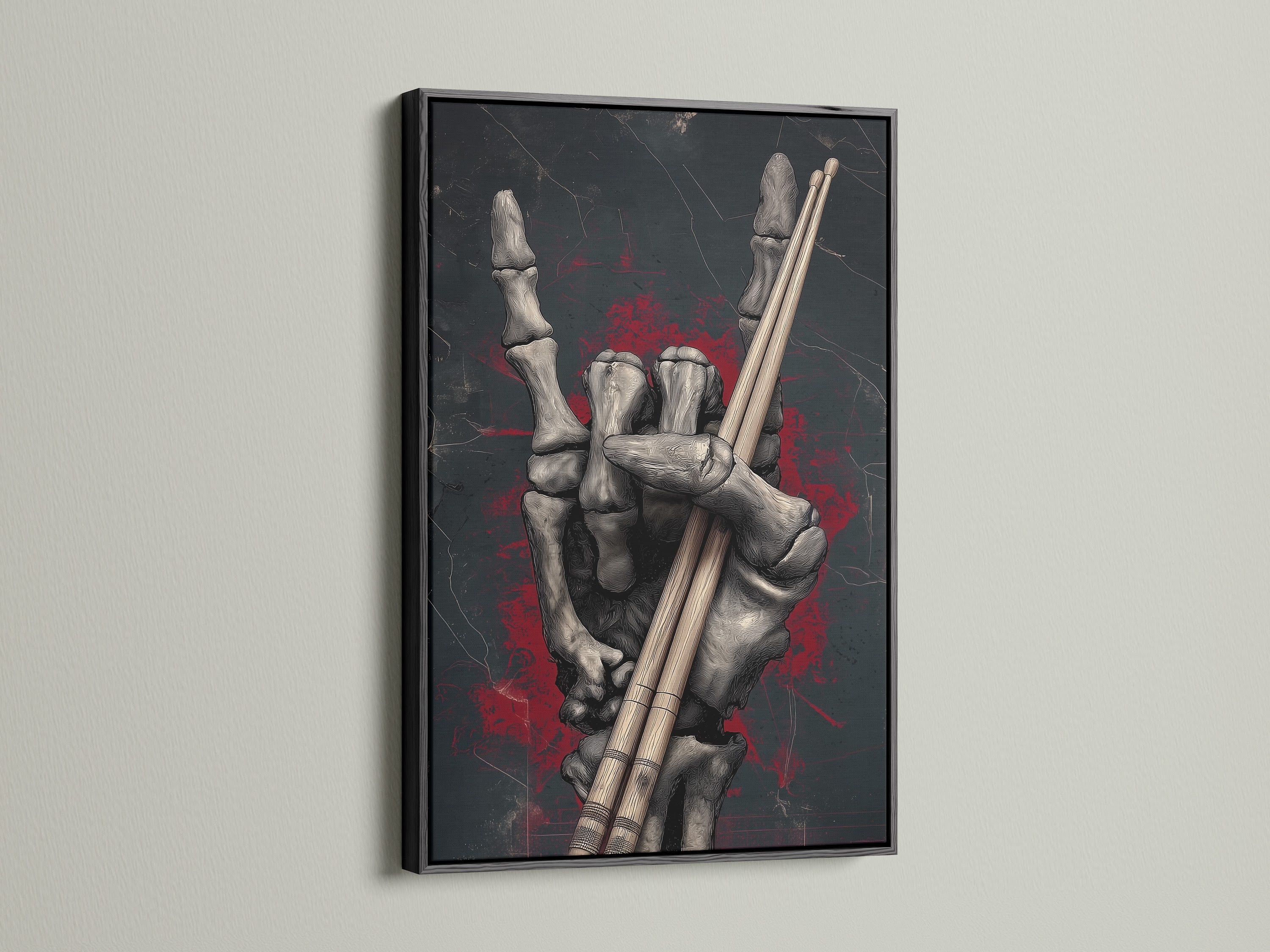 Skeleton Hand Drumsticks artwork with a black frame. This gothic canvas art is ideal for music studio art. It's a dark academia print that captures the essence of rock culture. A great skeleton art print to celebrate unique artwork. It enhances studio decor.