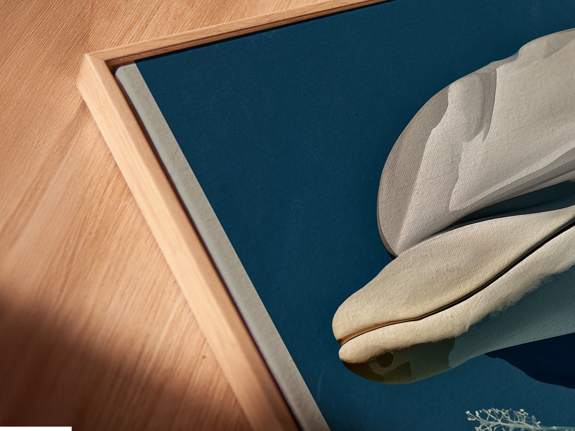 A close-up of a canvas print in a floating frame. The whale botanical art print is perfect for adding a touch of the ocean to your home. The tropical hibiscus canvas print is perfect for coastal bedroom decor.