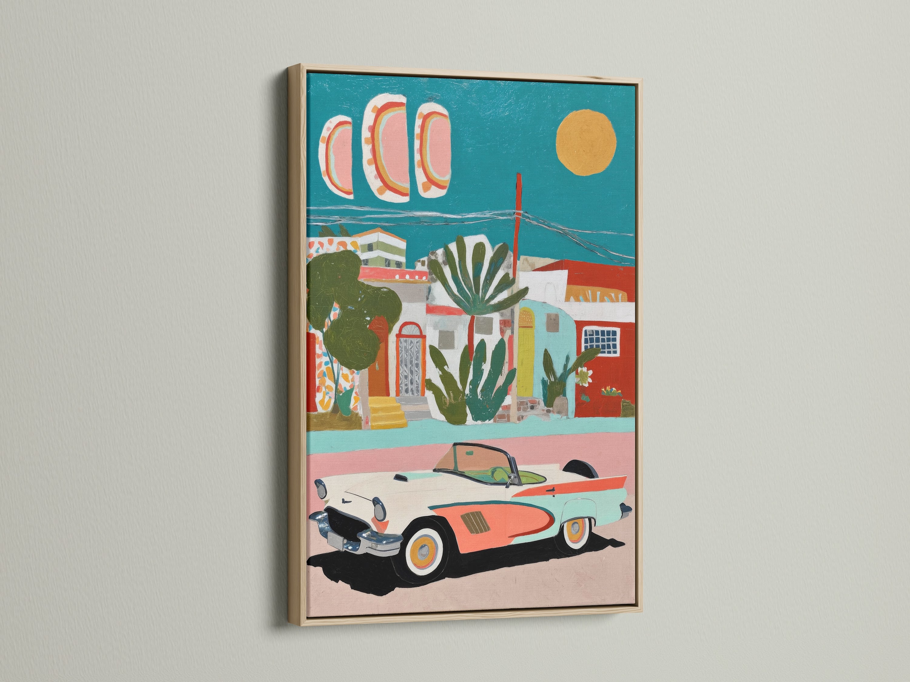 Mediterranean Village artwork with a vintage car. The artwork features coastal teal and coral colors that provide retro decor. The art print is displayed in an oak frame. It would be great for living rooms vacation homes boutique wall art studios or cafes.