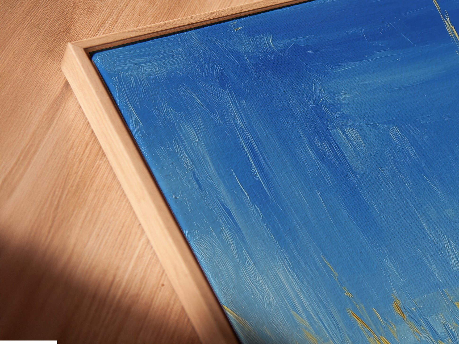 A close-up shows a canvas print in a floating frame. The frame enhances the artwork. It creates a modern gallery look. The floating frame adds depth and dimension to the piece. It makes the artwork stand out.