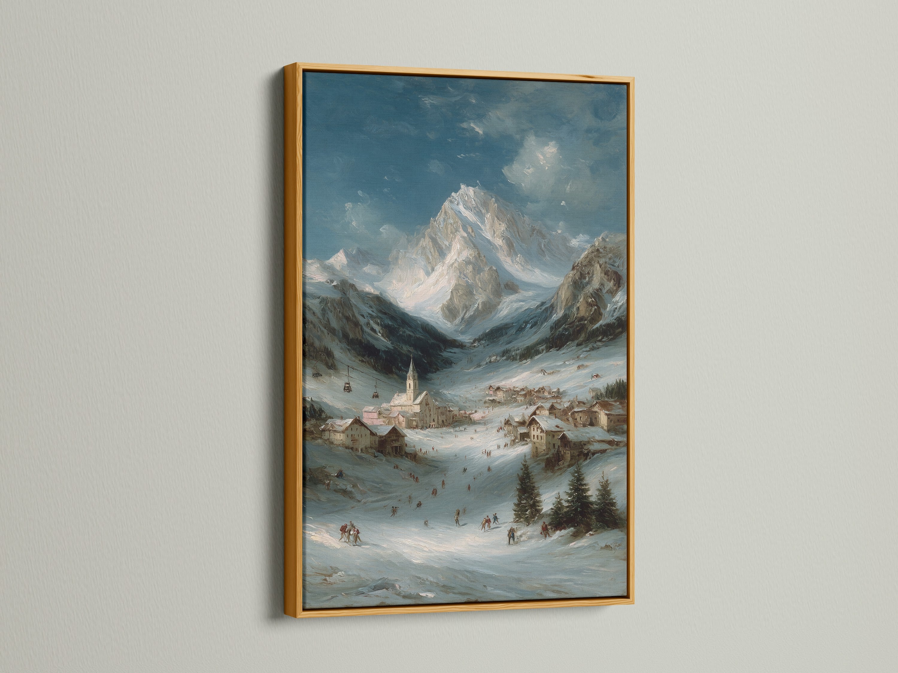 Alpine Village art print in a gold frame. The winter mountain landscape adds a touch of elegance. It is a perfect piece of mountain home decor. The snow scene print is great for creating a cozy atmosphere. The artwork has a lodge style.
