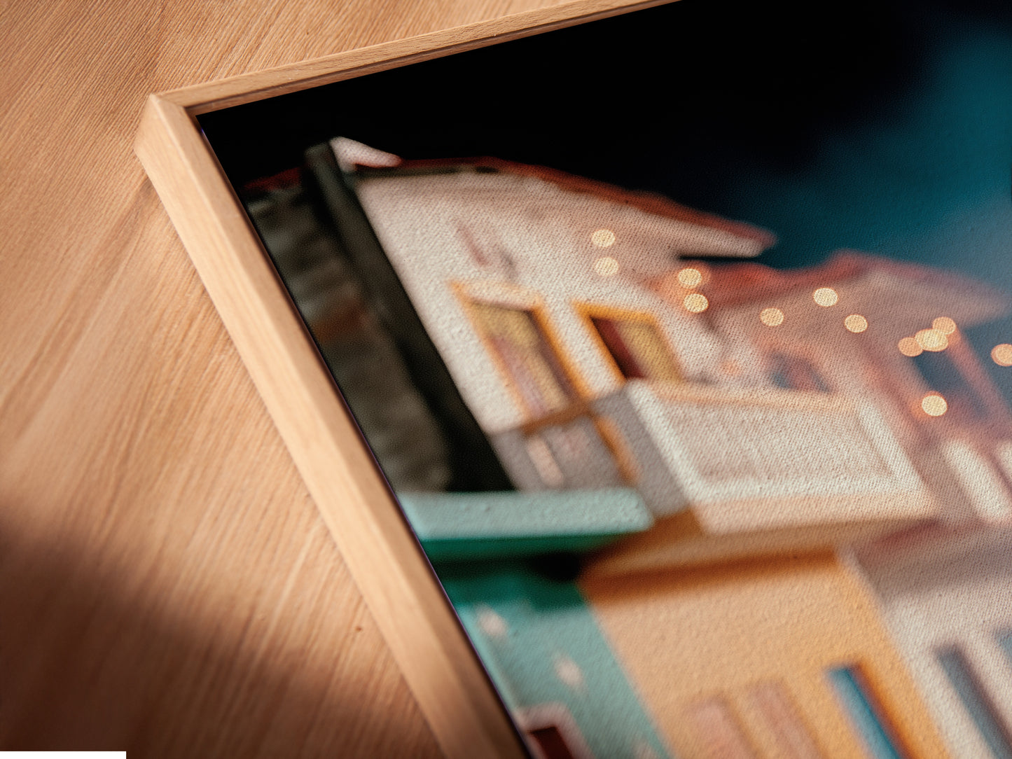 Close up shot of a canvas print in a floating frame. The artwork shows rustic bread wall art. It provides a modern touch to this food photography. Perfect kitchen art and cafe decor.