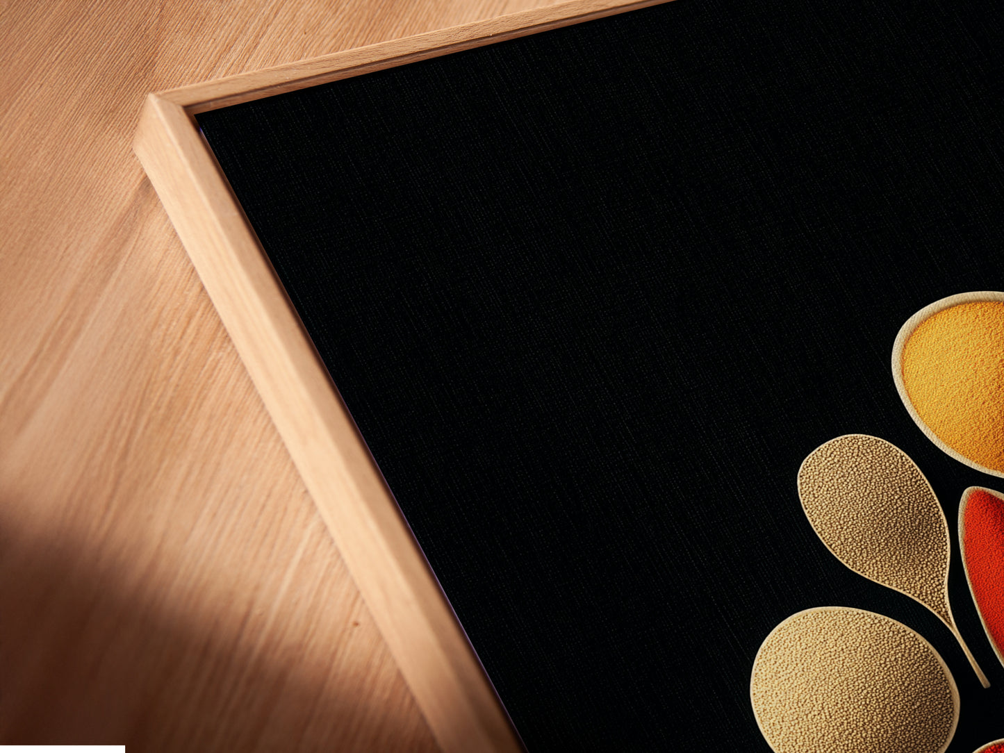 A close-up of Spice Spoons canvas print in a floating frame. This modern kitchen artwork adds sophistication to any space. The floating frame accentuates the culinary art print.