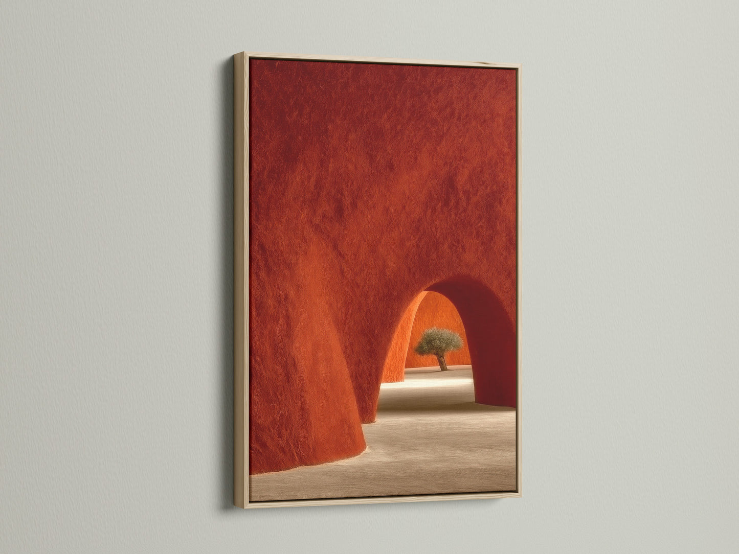 Oak Frame showcasing Desert Architecture Canvas Artwork. The artwork features terracotta adobe arches. It is ideal Southwestern minimalist decor for the bedroom. The oak frame enhances the warm earth tones of the art.