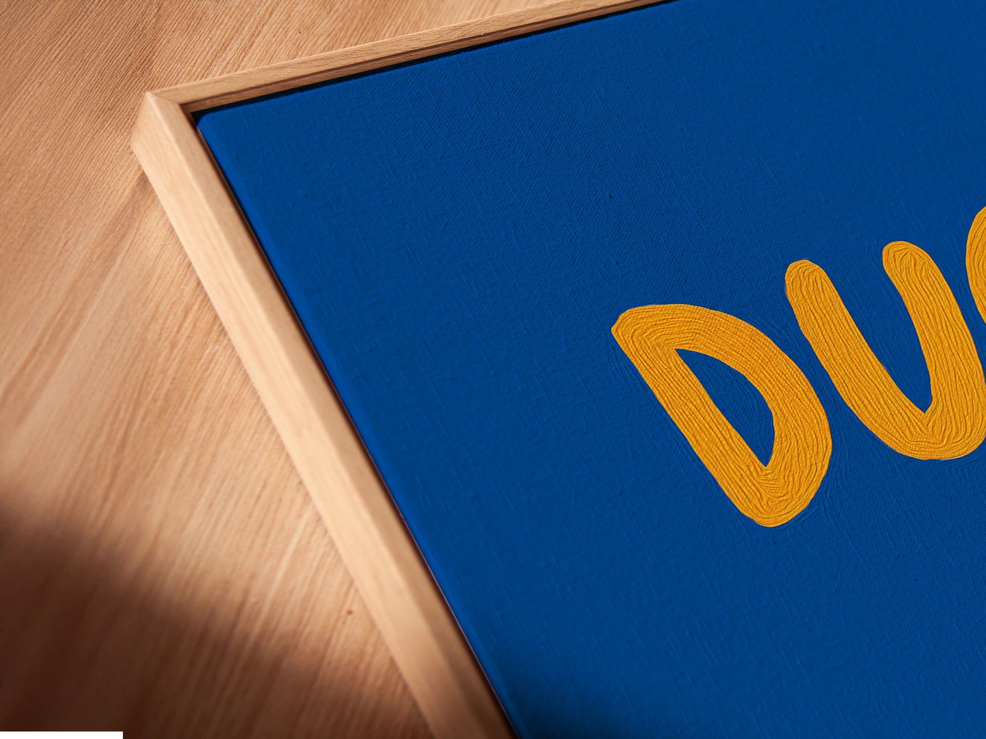 Close-up of a Canvas Print in Floating Frame. This duck artwork adds a playful touch to a kids room. The blue and orange colors create a contemporary style. Perfect as nursery wall decor this funny animal art makes a great gift.